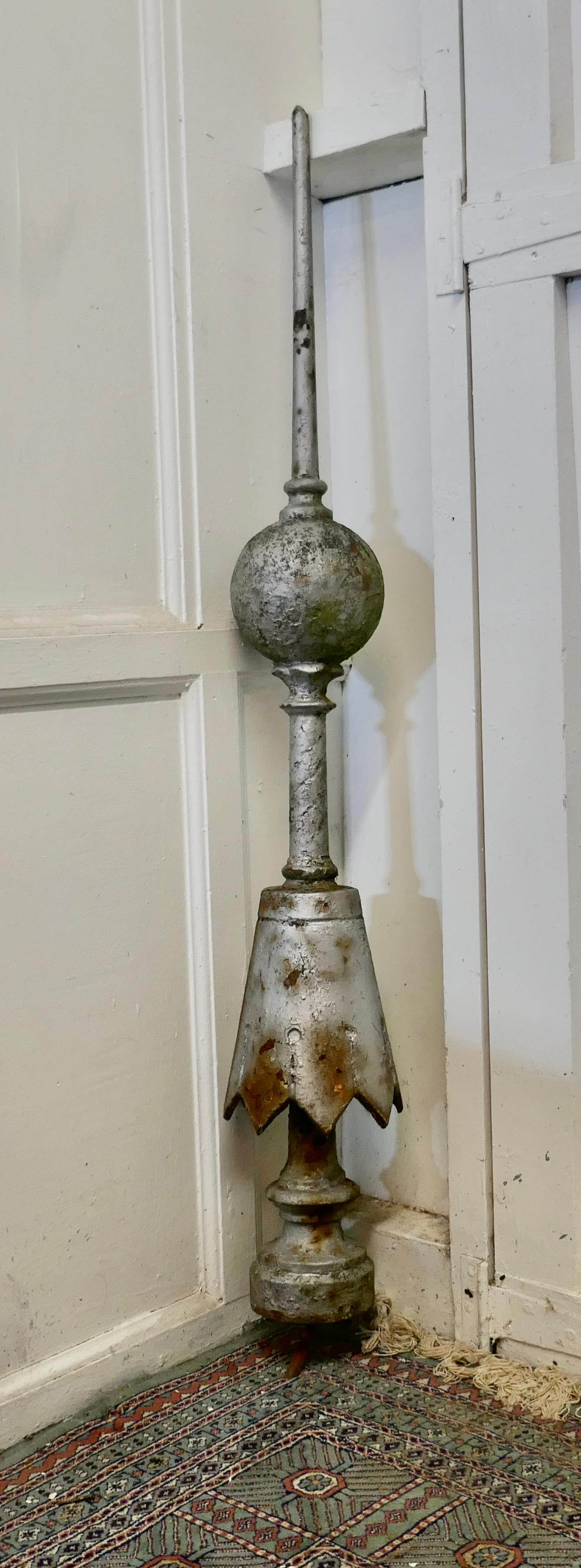 Long Victorian roof finial

A Super decorative piece, the iron Finial has a tall lance and ball shape
The piece is weather worn as you would expect but otherwise sound, and would make an excellent roof decoration
The Finial is 50” tall, the base