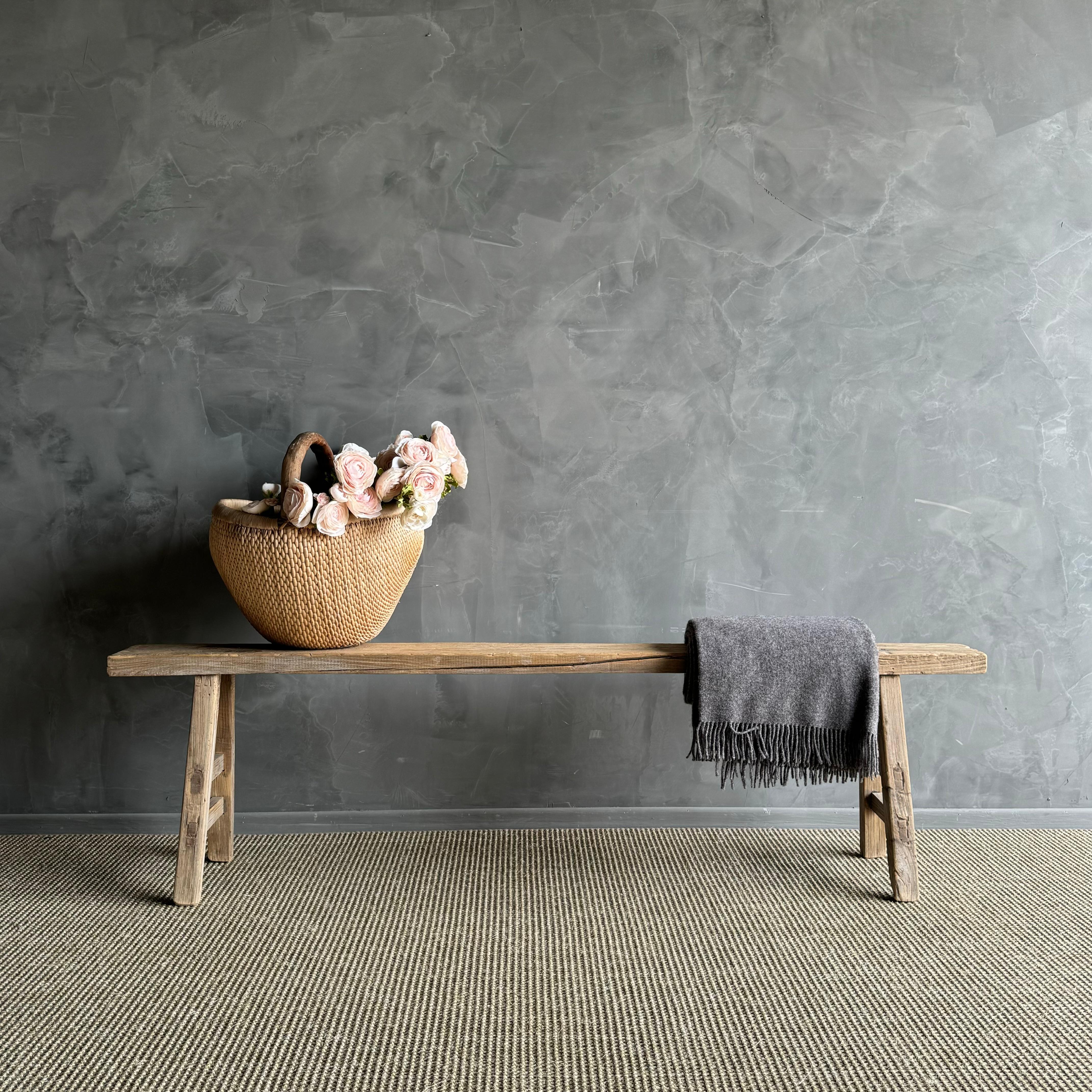 a rare find - the Vintage Elm Wood Long Skinny Bench. This authentic vintage elm bench is a true gem, with a hard-to-find extra long length that makes it stand out. The beautiful grain and fissures add character to each piece, making it truly unique