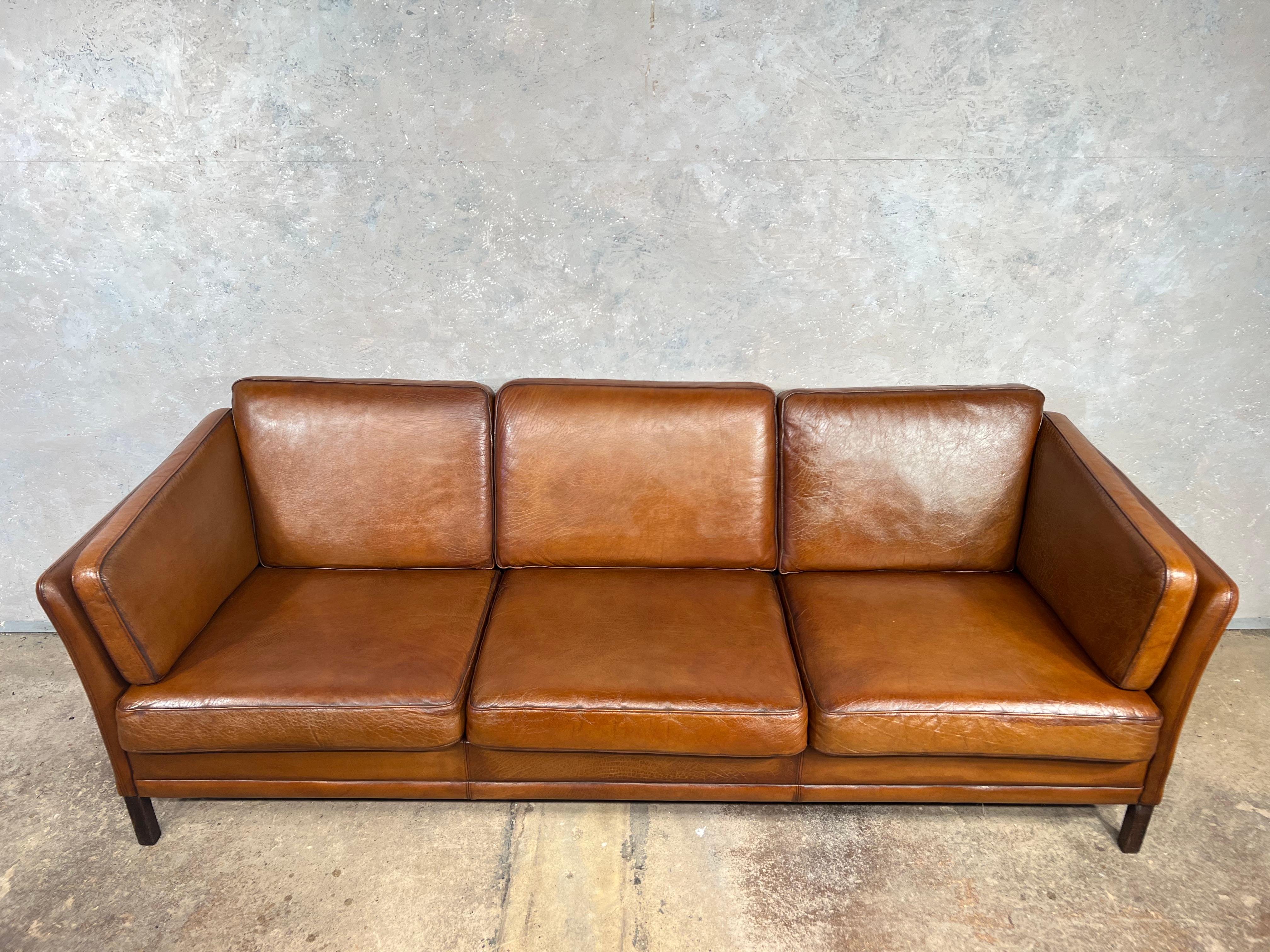 A stylish 1970s sofa designed by Mogens Hansen, great design with beautiful lines, sits wonderfully.

Stunning hand dyed tan colour, great patina and finish.

 
