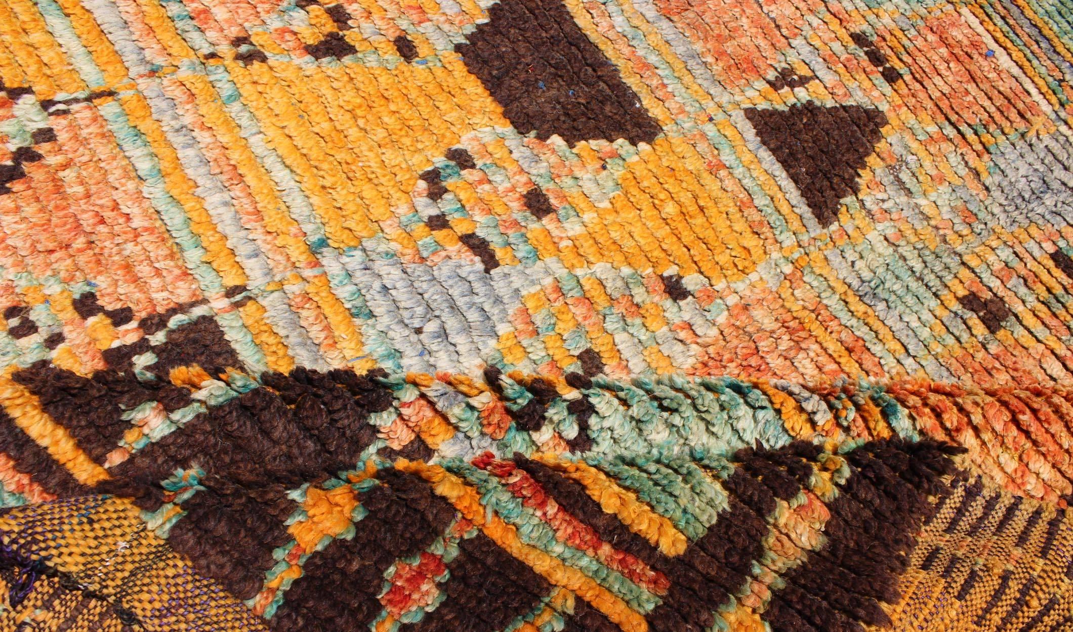 Mid-20th Century Long Vintage Moroccan Runner with Tribal Design in Orange, Brown, Blue and Green For Sale