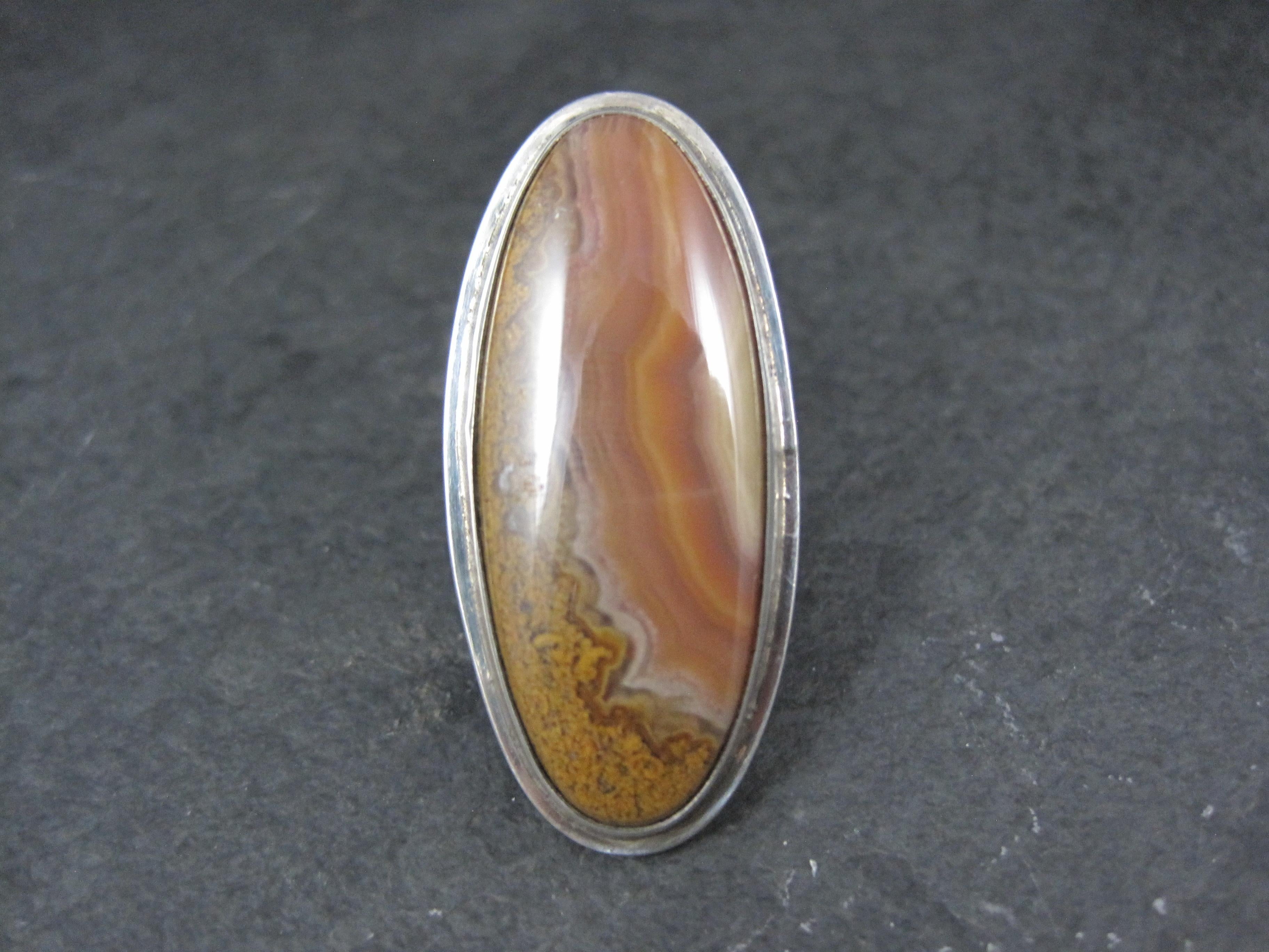 This beautiful Southwestern ring is sterling silver with a jasper gemstone.

The face of this ring measures 3/4 of an inch east to west and 1 9/16 inches north to south.
Size: 7

Marks: Sterling

Condition: Excellent