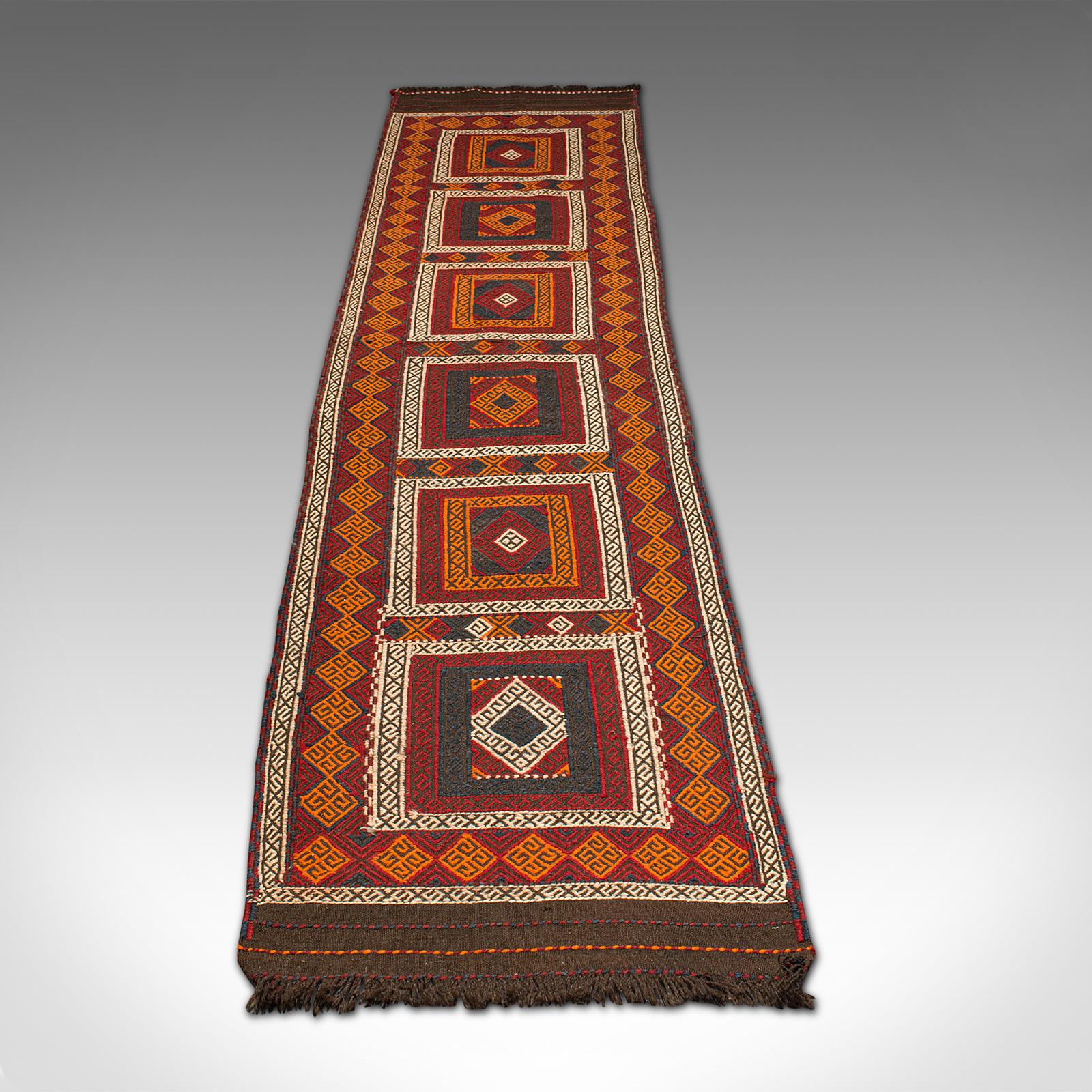 This is a long vintage Suzani Kilim runner. A Caucasian, woven hallway or entrance hall carpet, dating to the late 20th century, circa 1980.

Impressively long in size for the larger hallway at 74cm x 344cm (29.25