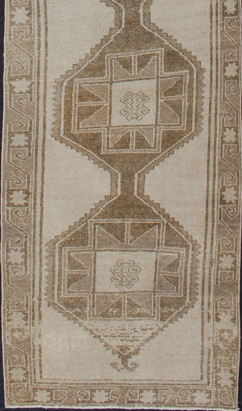 Hand-Knotted Long Vintage Turkish Oushak Runner with Medallions in Creams and Tans For Sale
