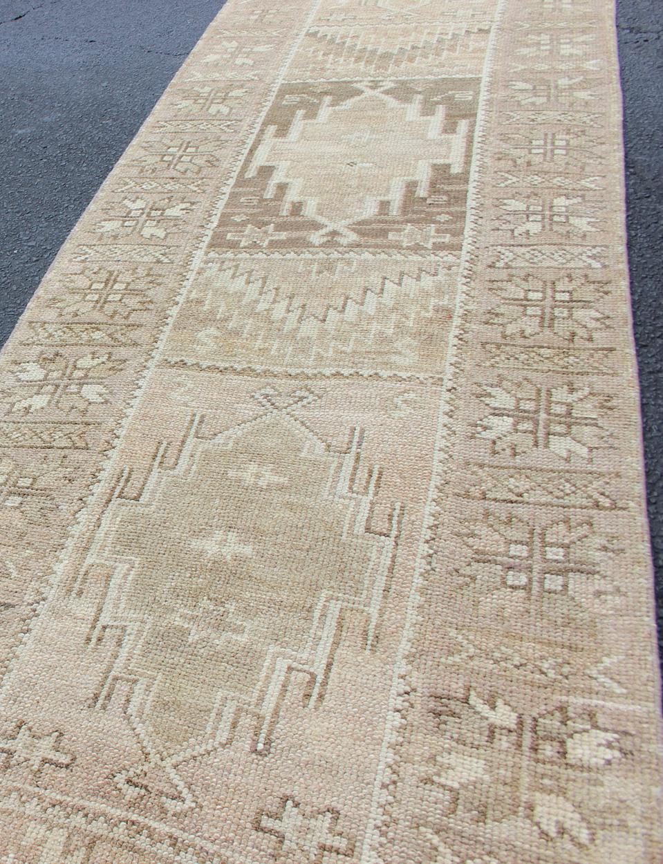 20th Century Long Vintage Turkish Oushak Runner with Medallions in Earth Tones For Sale