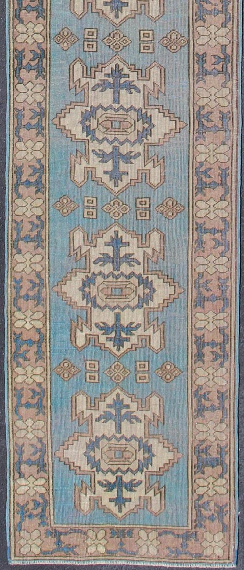 Long vintage Turkish runner with geometric design in light blue and taupe
Vintage Oushak runner from Turkey with Medallion design in various color tones, rug en-176085, country of origin / type: Turkey / Oushak, circa 1930

This vintage Turkish