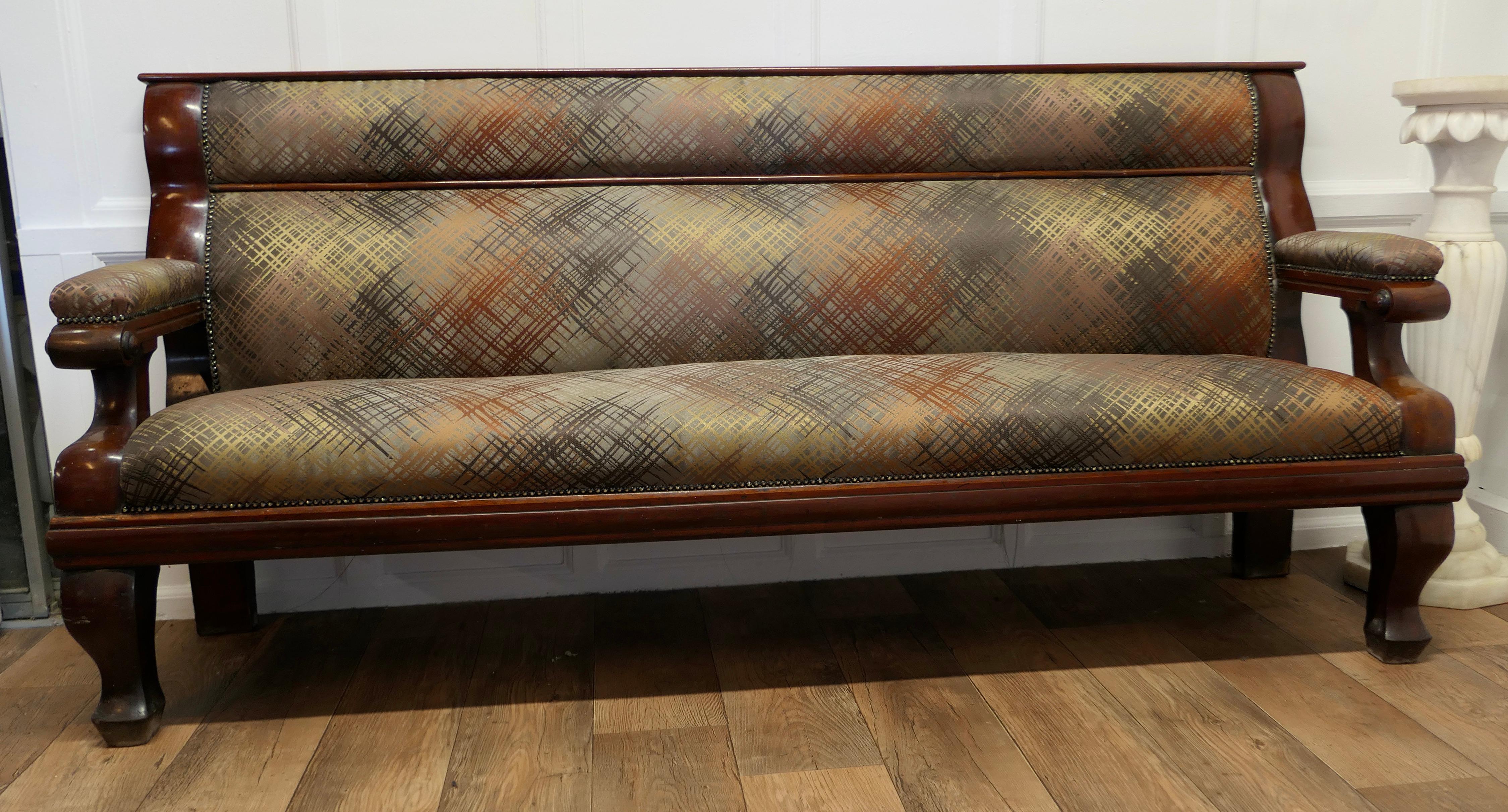 Long Waiting Room Seat or Hall Bench

This is a very sturdy and heavy piece, the back and seat are newly upholstered, in an abstract design in autumn colours
The bench has a long seat with upholstered arms at each end and a panelled back

This