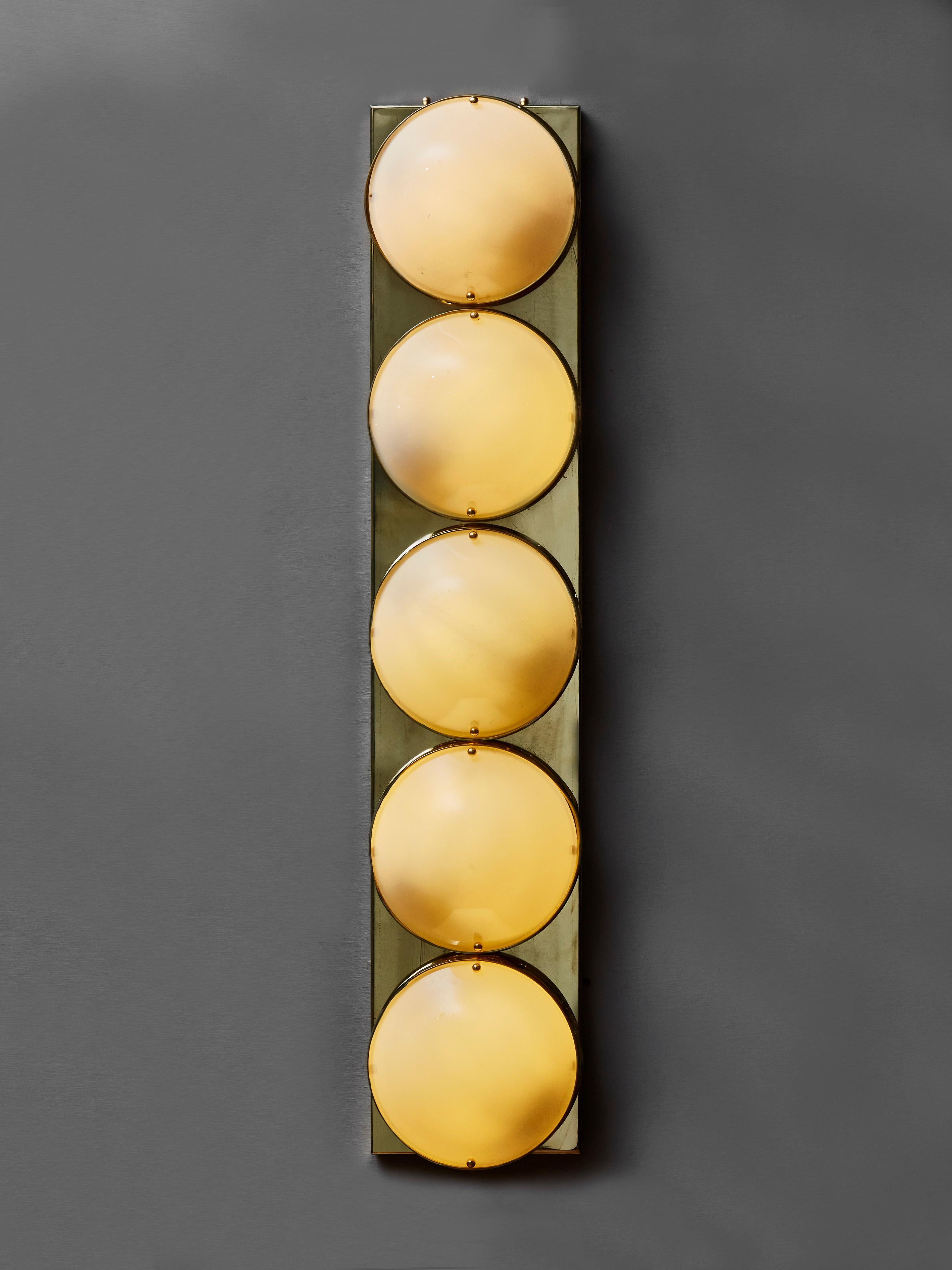 Elegant pair of long wall sconces in brass and opaline glass globes. 5 light bulbs.
Creation by Studio Glustin.
France, 2021.