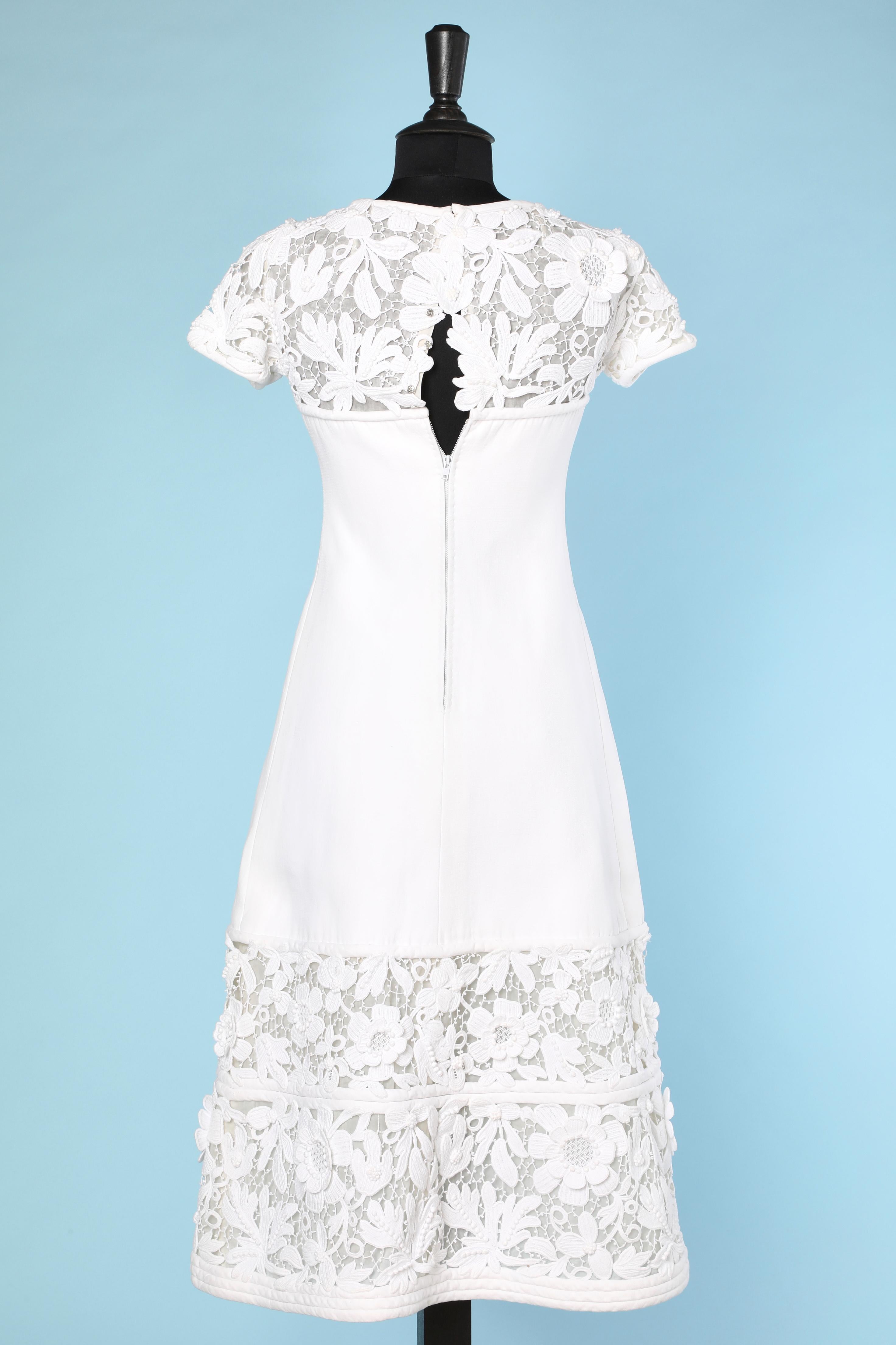 Long white cotton dress with flowers crochet appliqué. 
Zip and snap in the back 