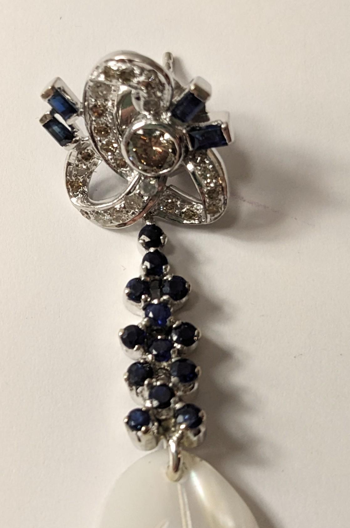 Women's Long White Gold Earrings with Diamonds and Sapphires and Mother of Pearl Feather For Sale