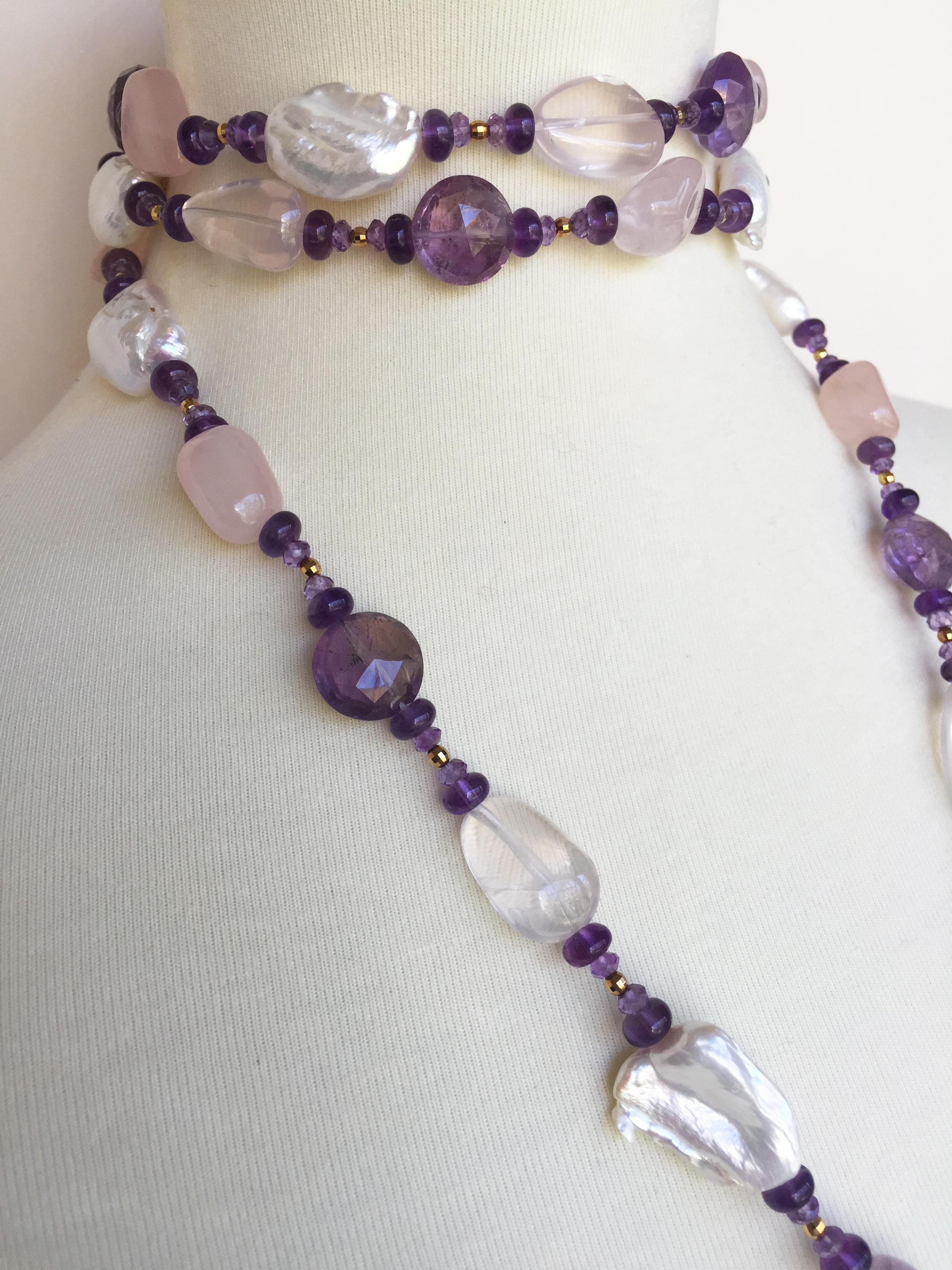 This extra long white pearl, amethyst, and rose quartz necklace with tassel and 14k yellow gold is 50. 5 inches long with a 4.75 inch removable tassel. The necklace is capable of fitting into many different styles, because it is extra long, has a