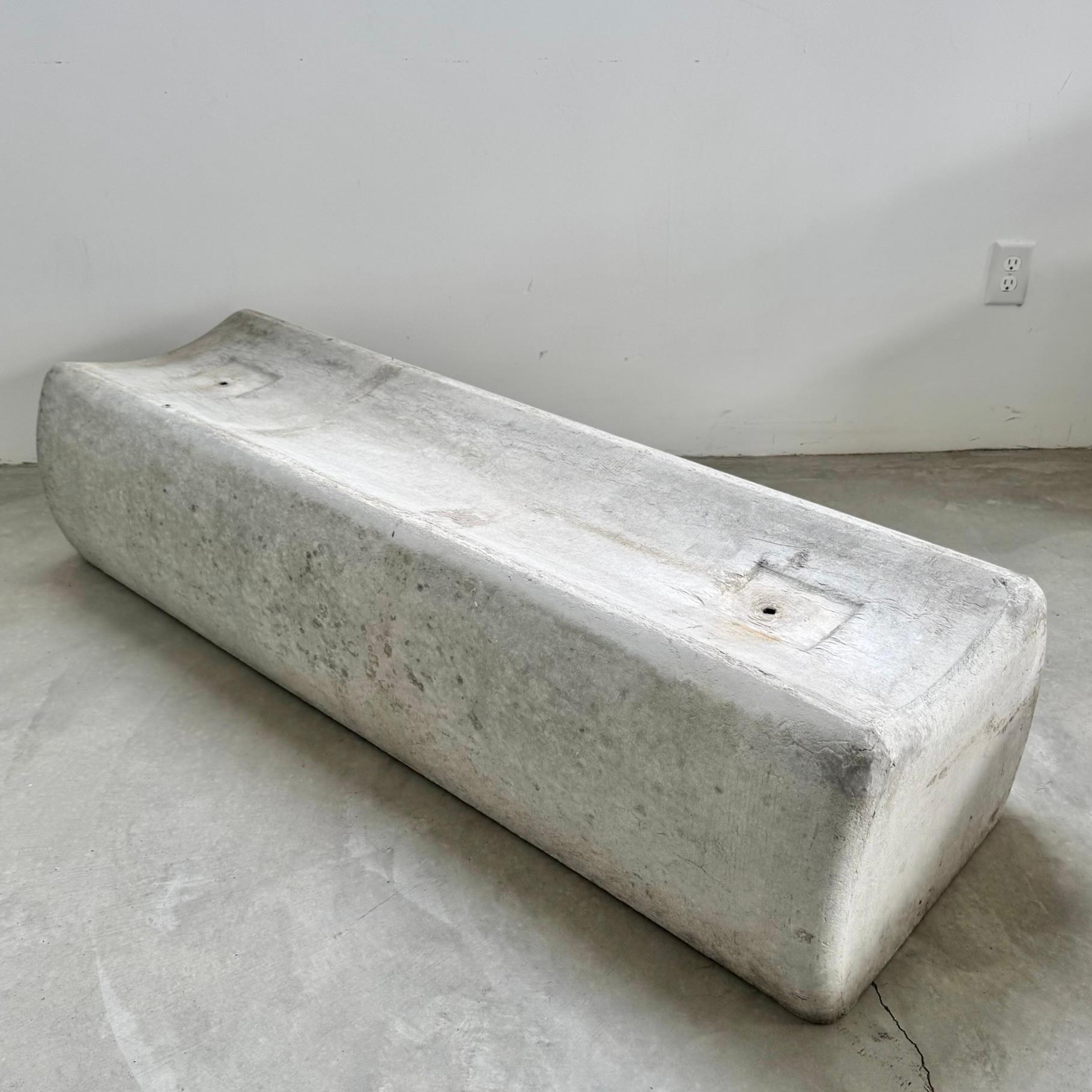 Substantial mid-century concrete seat/ bench by Eternit, circa 1960s. Imagine it placed in a quiet garden, dappled in warm sunlight beneath a swaying tree. Perfect minimal concave design with convex sides that bow out gently. The bench is made of