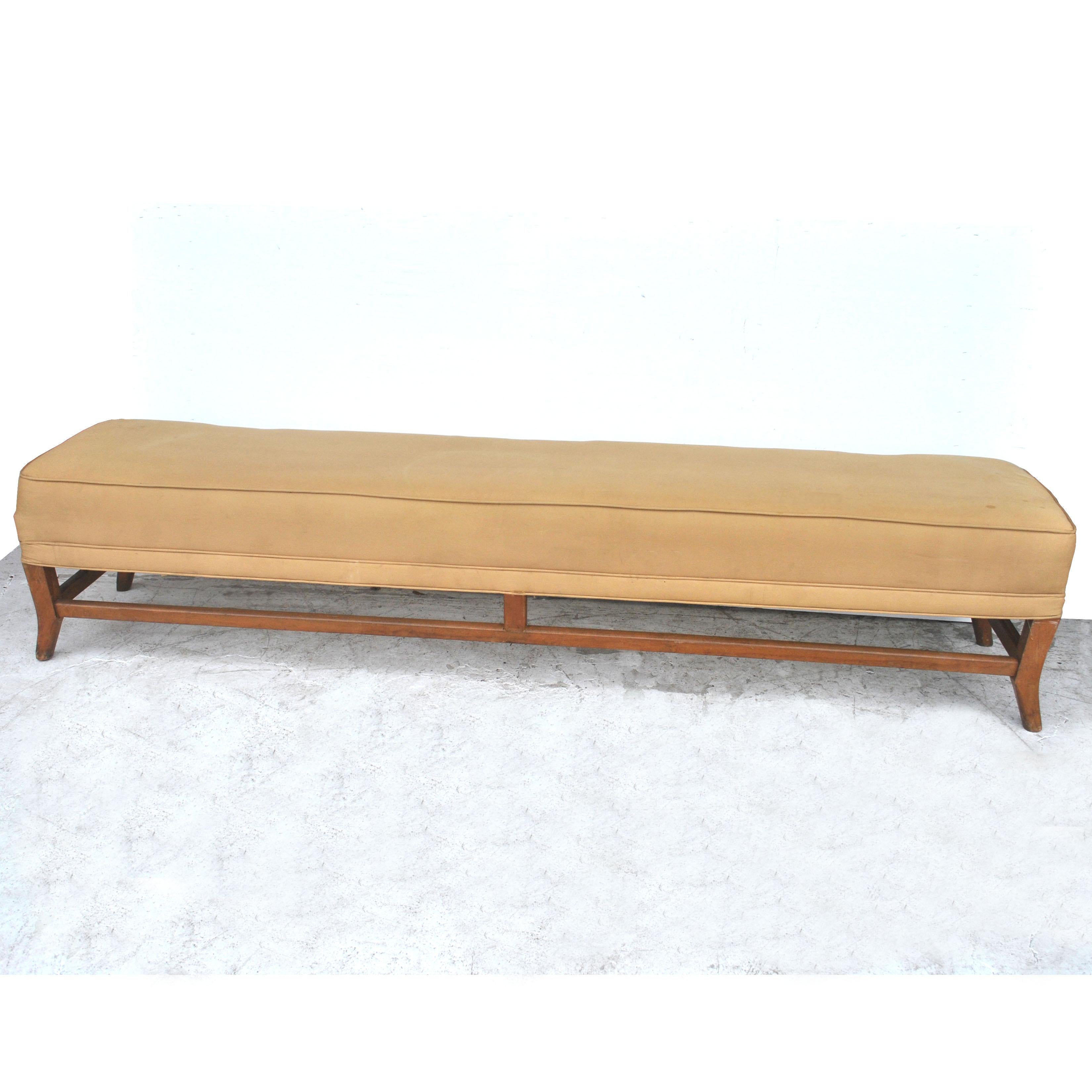  A 7.5 ft mid-century vintage bench upolstered in a silk blend fabric. Walnut frame with splayed legs. 
Reupholstery recommended.