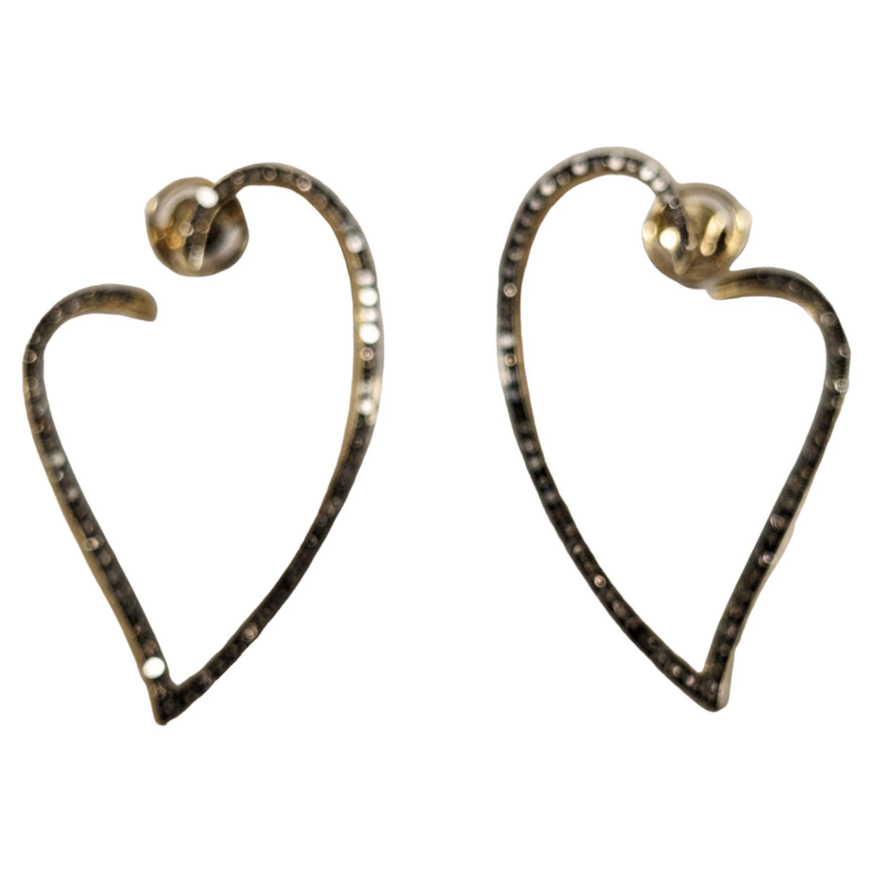 Long Yellow Gold Earrings with Brown Diamonds
Long earrings in yellow gold, with an openwork, wavy heart motif, with a row of brilliant-cut brown diamonds in front
138 btes  1,30ct aprox  
Purity  VS
Dimension  42x24mm


READY TO SHIP
*Shipment of