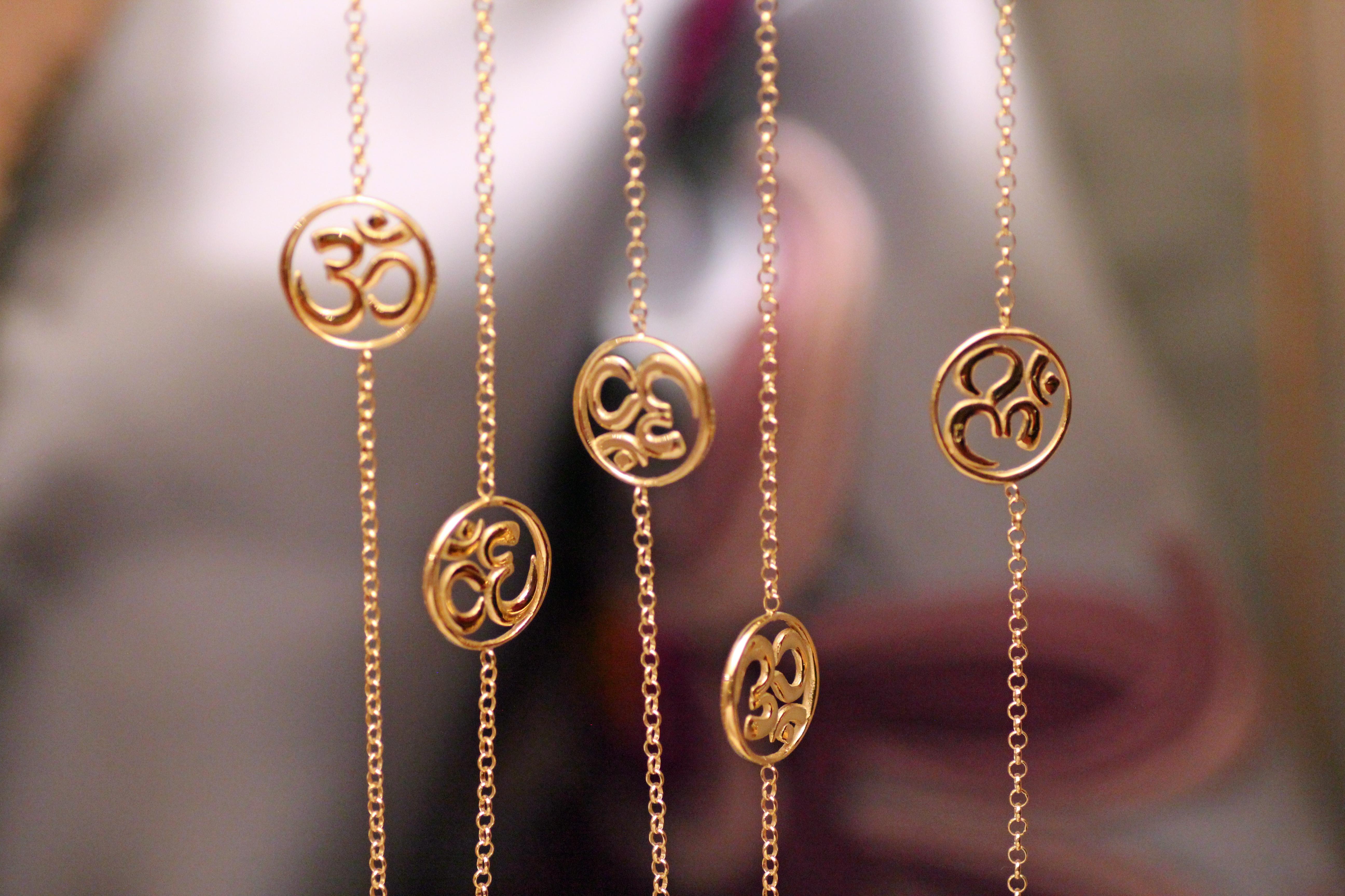 Modern Handcrafted Long Pendant Necklace in 14Kt Gold with the OM Symbol For Sale