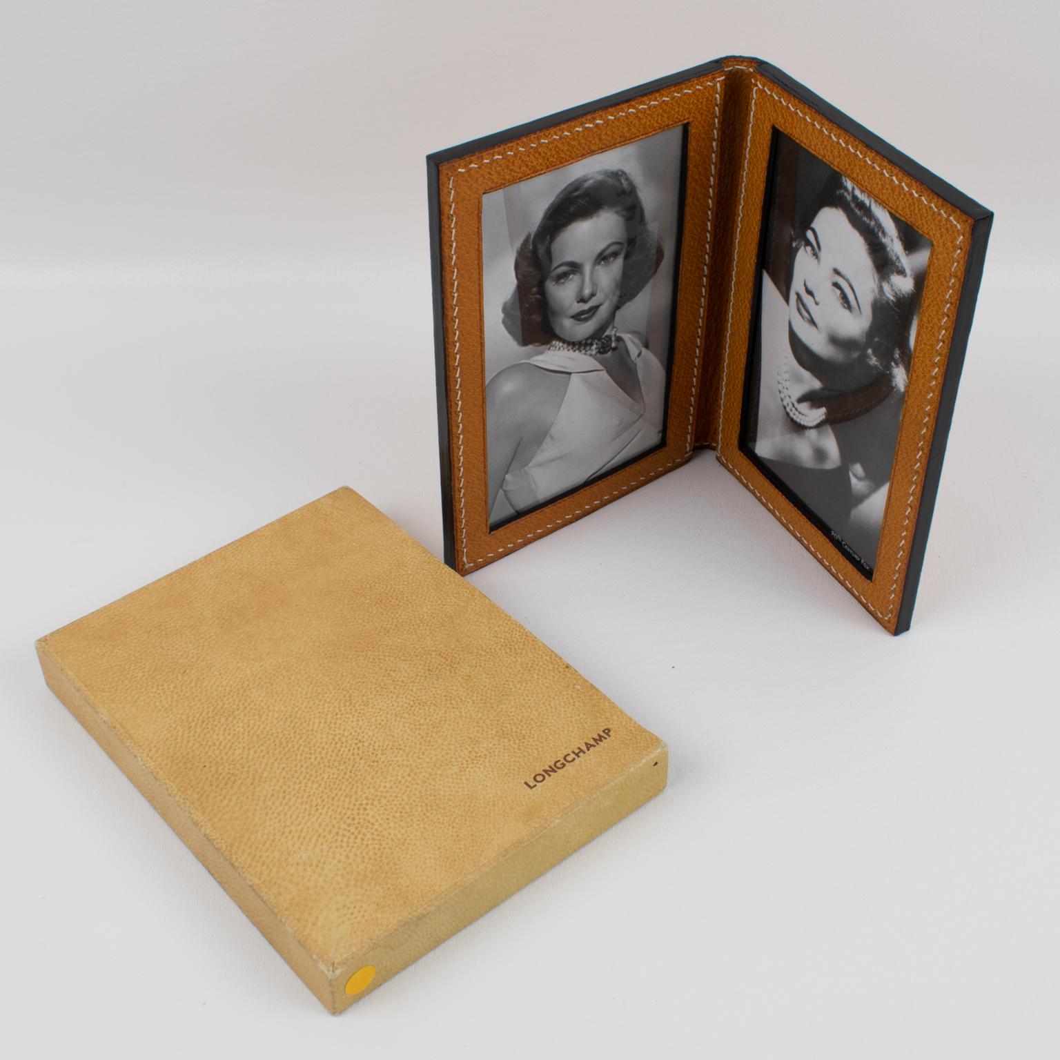 Sophisticated 1940s modernist leather picture photo frame by Longchamp, Paris. Natural light cognac leather with pattern and hand-stitched finish. This is a double-view folding frame that can also be used in travel. In pristine condition, still with