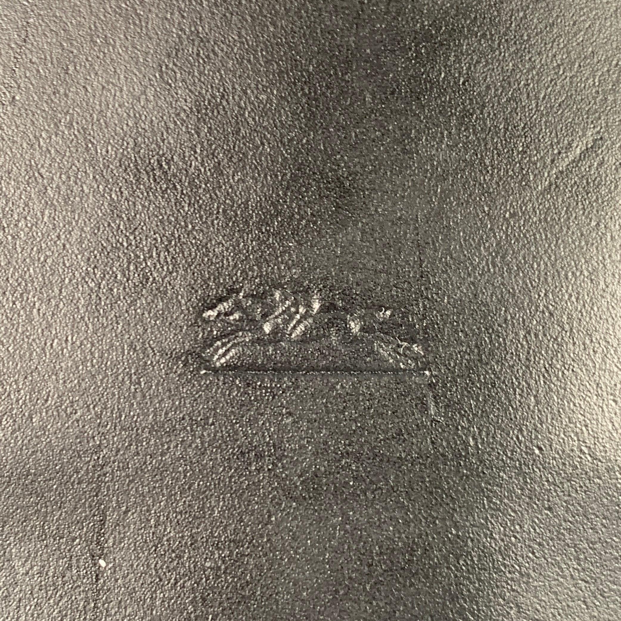 LONGCHAMP shoulder bag
in a black faux leather featuring two top handles, canvas interior with one patch pocket, and zip closure. Comes with dust bag. Made in France.Very Good Pre-Owned Condition. Minor signs of wear. 

Marked:   545912 BCHR