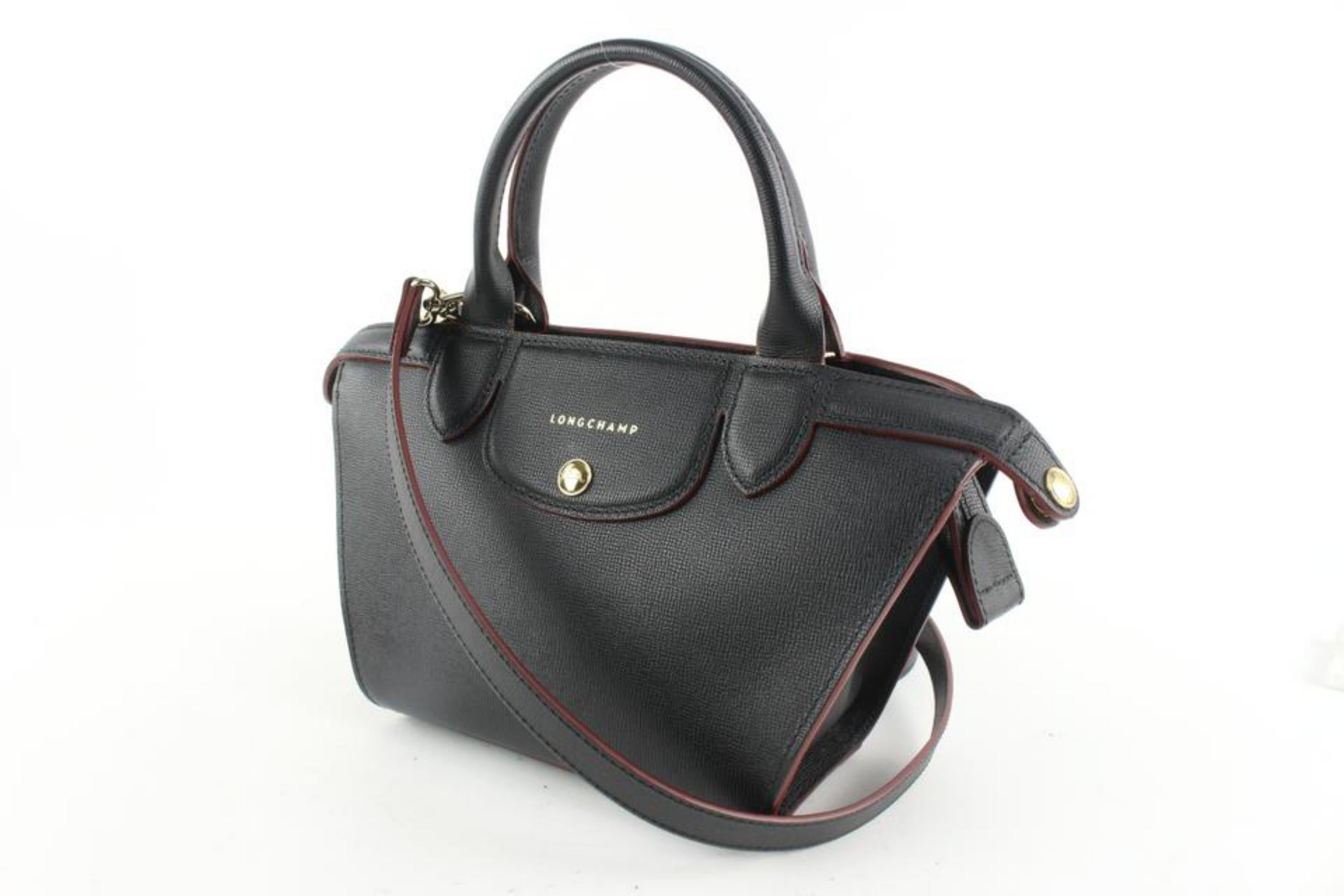 Longchamp Black Leather Extra Small Le Pliage 2way Mini 1224lc25
Date Code/Serial Number: 1001202 1116813001
Made In: France
Measurements: Length:  11