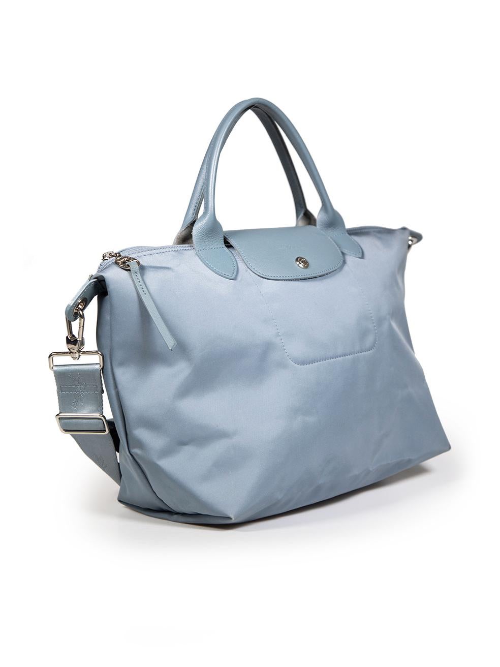 CONDITION is Very good. Minimal wear to bag is evident. Minimal discolouration to the front, back and bottom on this used Longchamp designer resale item.
 
 Details
 Model: Le Pliage
 Blue
 Cloth textile
 Medium tote bag
 Silver tone hardware
