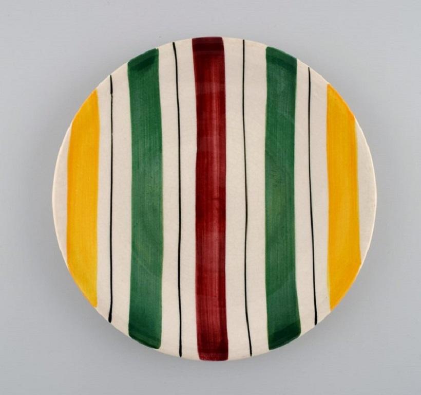 Longchamp, France. 10 plates in glazed faience with hand-painted striped decoration. Mid-20th century.
Diameter: 21 cm.
In excellent condition.
Stamped.