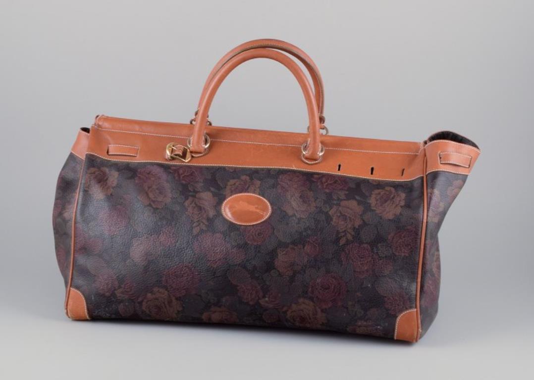 French Longchamp, France. Travel bag in full-grain leather with a rose motif. For Sale