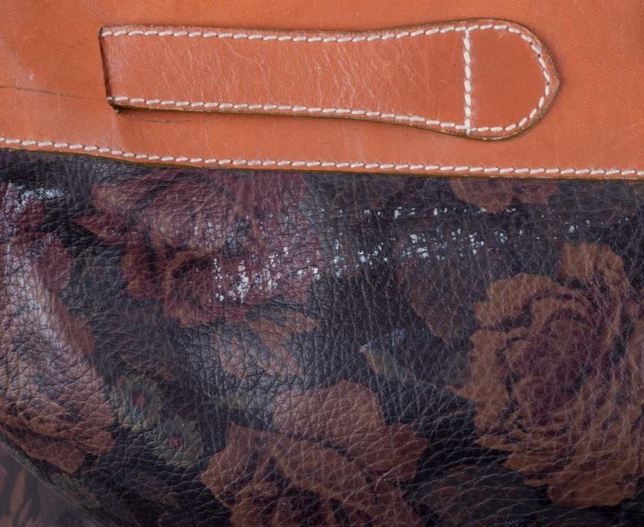 Leather Longchamp, France. Travel bag in full-grain leather with a rose motif. For Sale