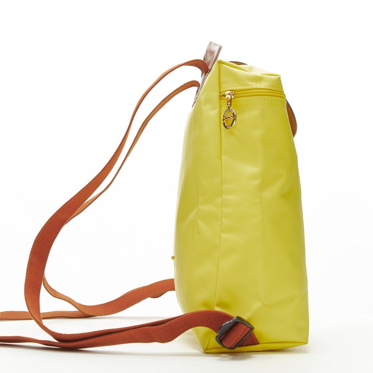LONGCHAMP Le Pliage yellow nylon brown canvas trim foldaway backpack bag In Excellent Condition For Sale In Hong Kong, NT