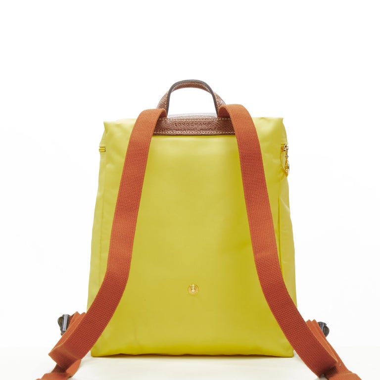 Women's LONGCHAMP Le Pliage yellow nylon brown canvas trim foldaway backpack bag For Sale