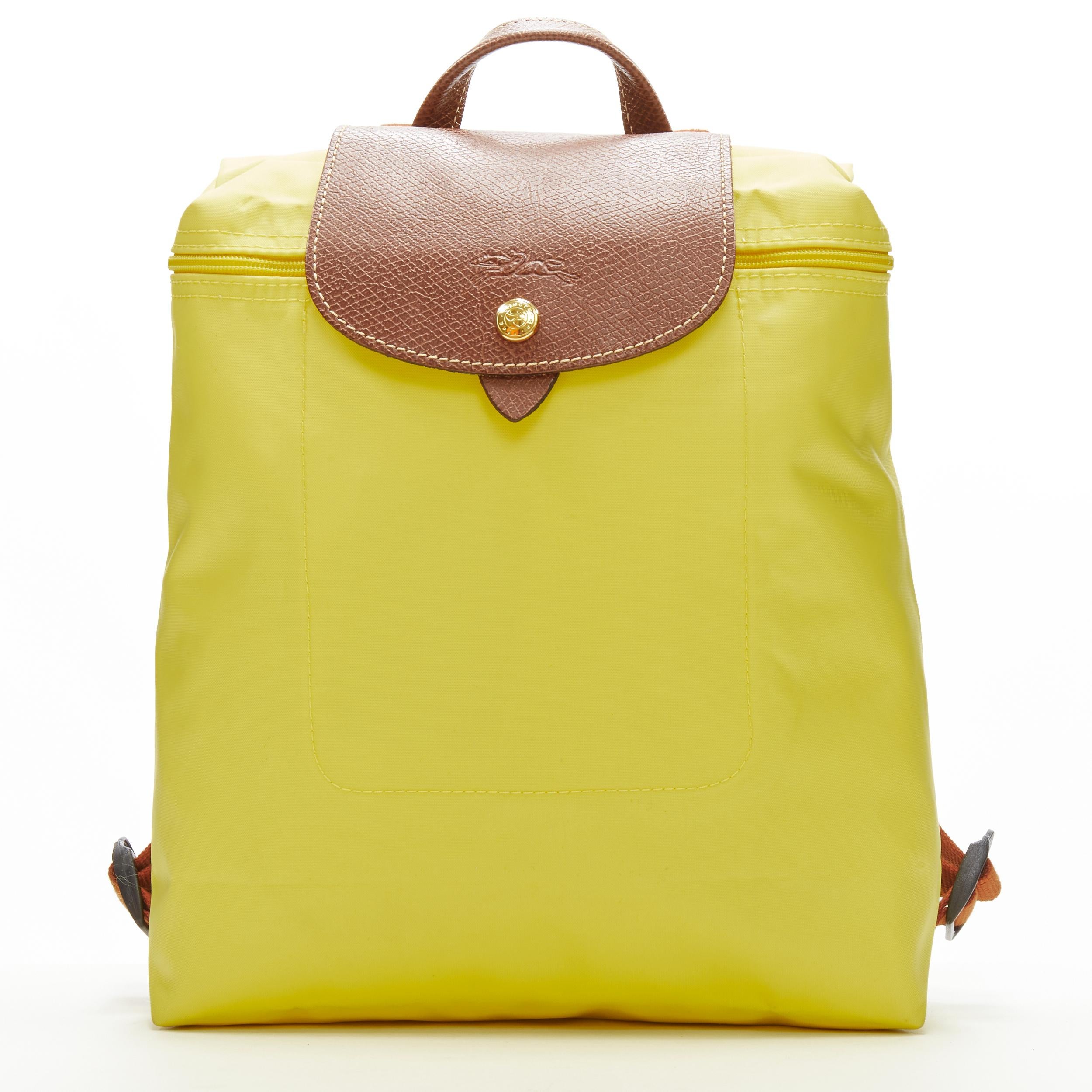 LONGCHAMP Le Pliage yellow nylon brown canvas trim foldaway backpack bag  For Sale at 1stDibs
