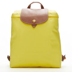 Longchamps - Sac à dos pliable en nylon jaune avec garniture en toile marron Le Pliage