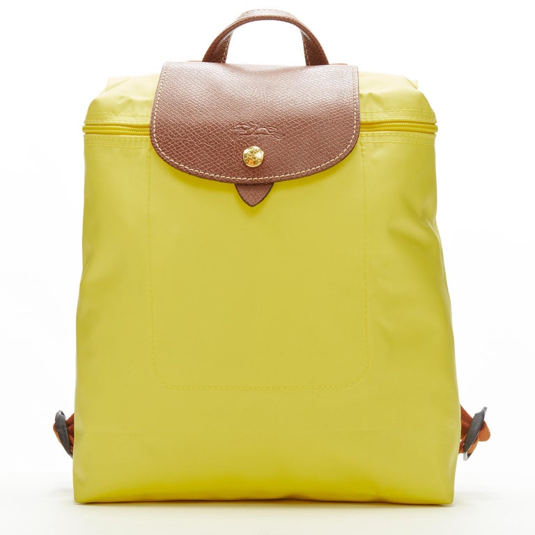 LONGCHAMP Le Pliage yellow nylon brown canvas trim foldaway backpack bag For Sale