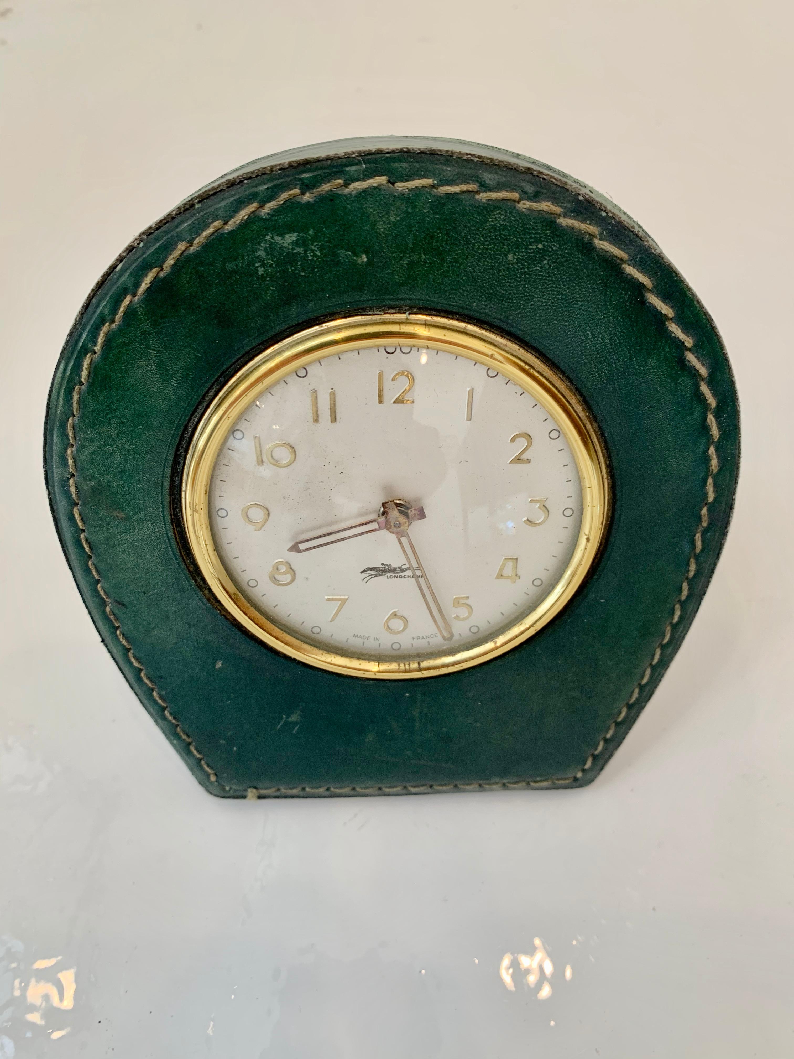 Handsome French leather desk clock by Longchamp. Great vintage condition. Keeps good time. Excellent patina to green leather. Great vintage condition.