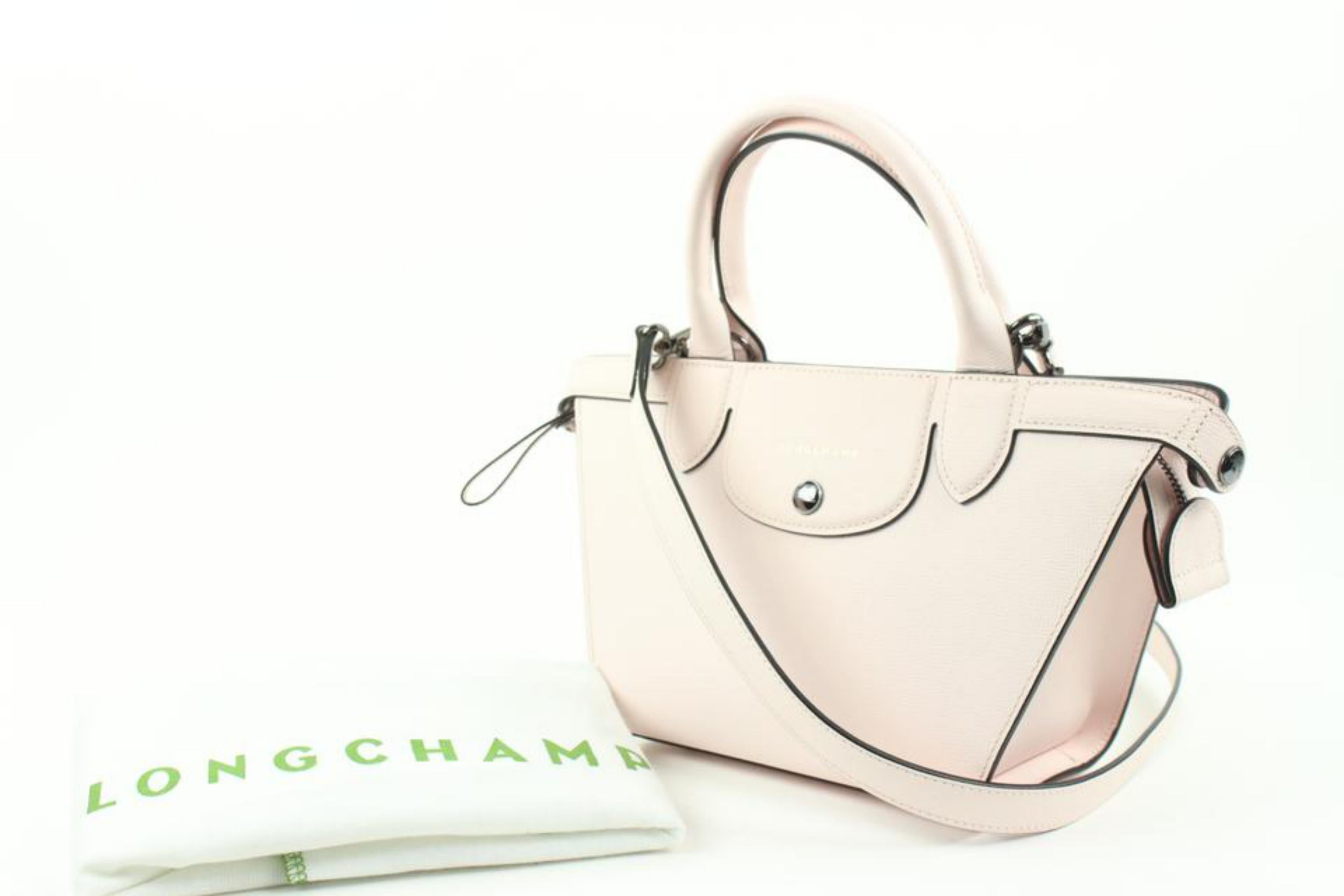 Longchamp Light Pink Leather Extra Small Le Pliage 2way Tote Bag 11lc113
Date Code/Serial Number: 1056540 11168113C59
Made In: China
Measurements: Length: 13 