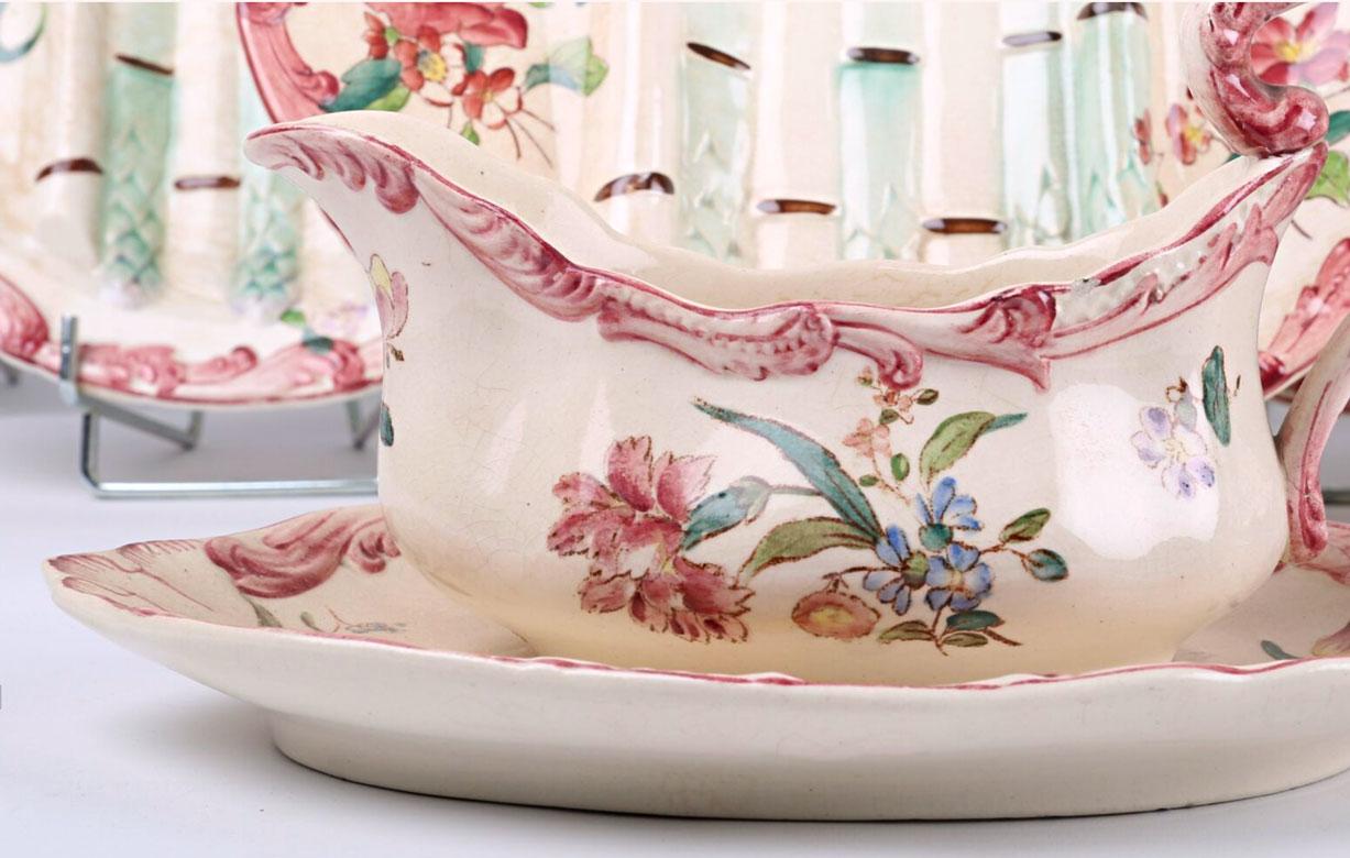 This charming set of French Longchamp Majolica Manufactory for asparagus is composed of 15 pièces. Beautifully embossed hand-painted asparagus create space for the sauce on the 12 dinner plates, the rectangular-shaped dish has his inside strainer