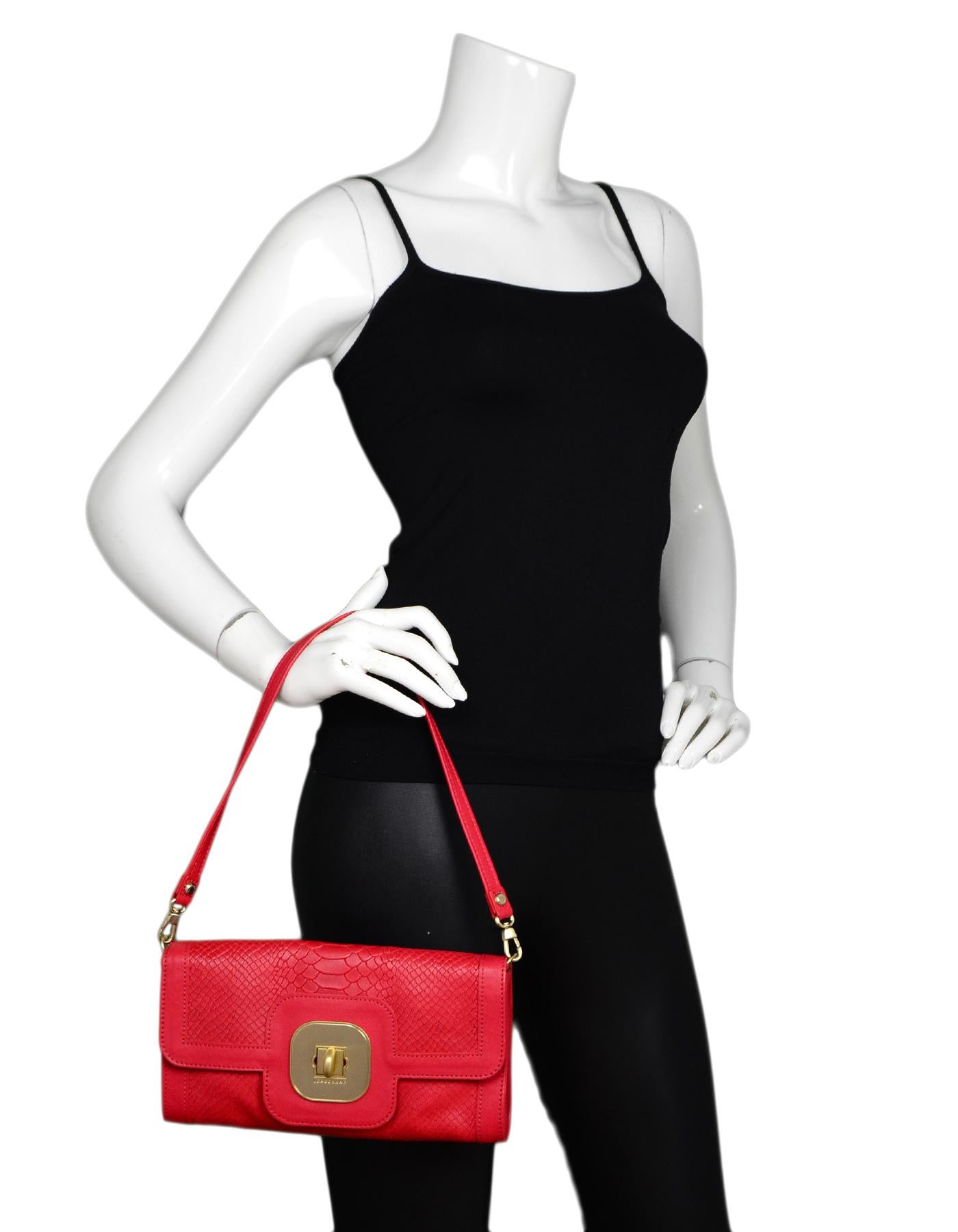Longchamp Red Leather Embossed Snake Gatsby Flap Clutch/Shoulder Bag

Made In: France
Color: Red
Hardware: Goldtone
Materials: Embossed leather
Lining: Leopard satin textile
Closure/Opening: Flap top with twistlock
Exterior Pockets: None
Interior