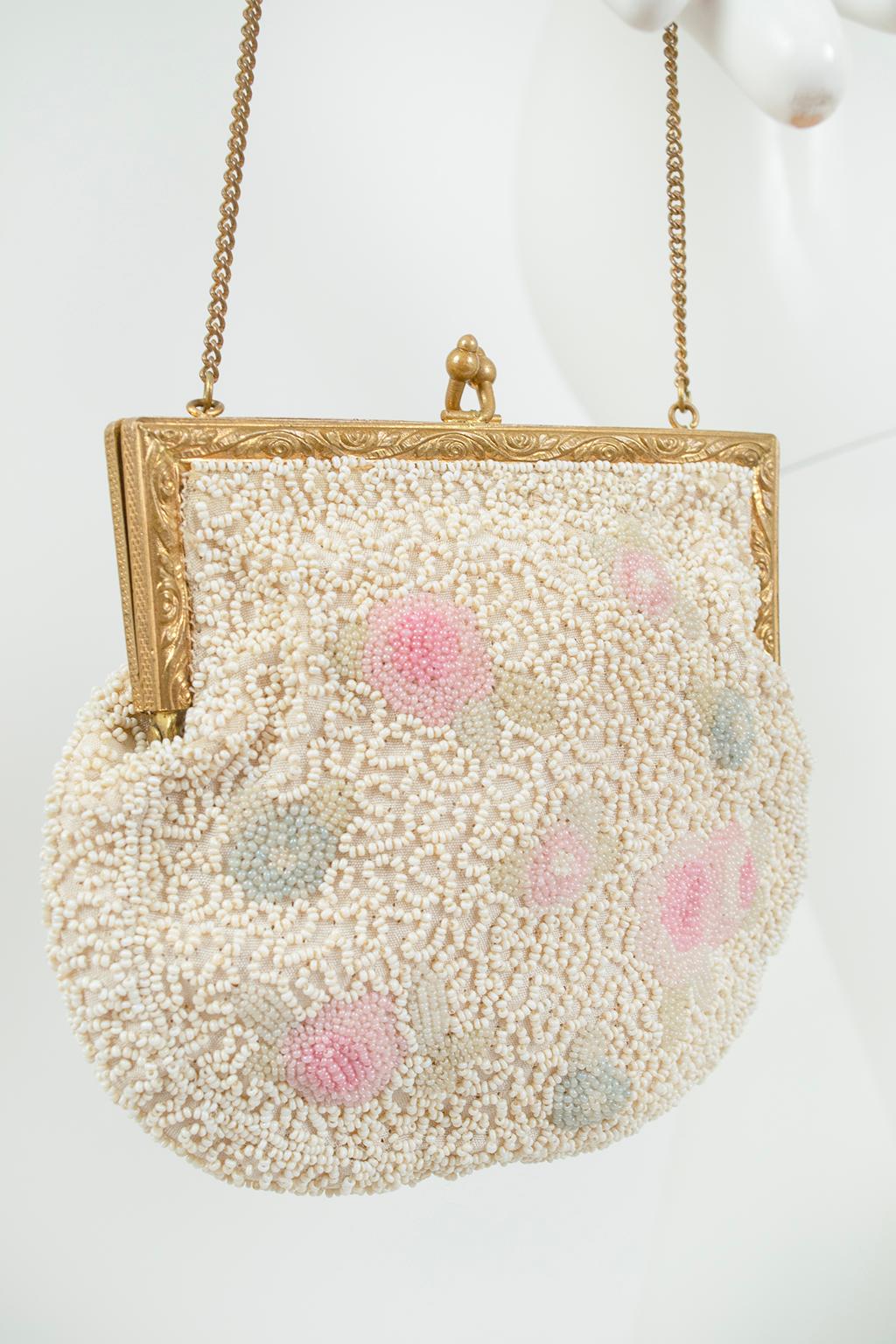 A rare Longchamps--not Longchamp--evening purse made even more noteworthy by its swirling micro bead pattern, punctuated by delicate pink and blue pavé flowers. A diminutive but powerful statement accessory.

Petite chain handle evening bag with
