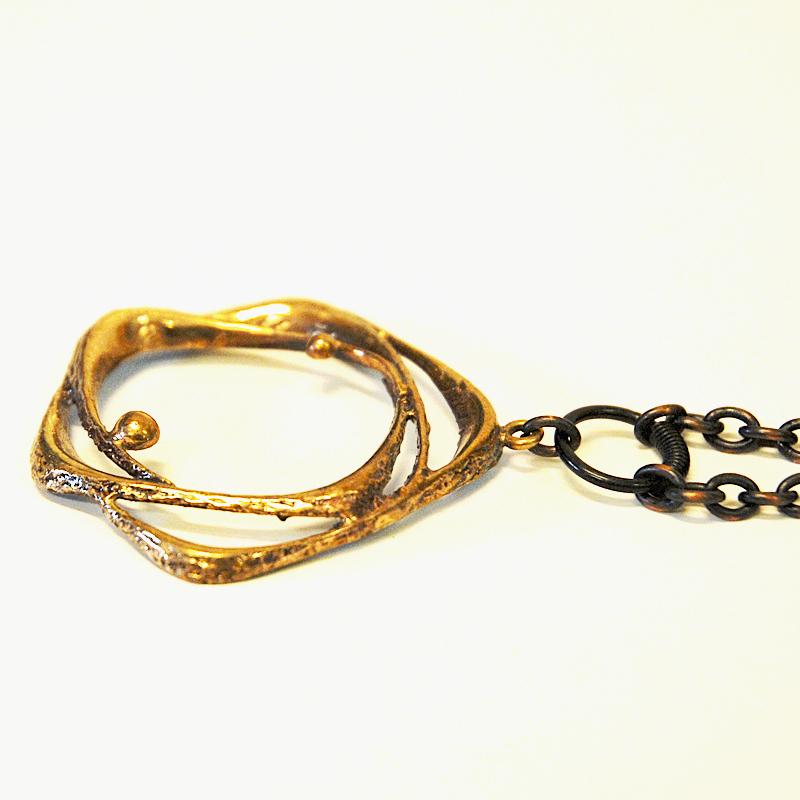 Bronze pendant with longer chain by designer Karl Laine for Sten & Laine, Finland, 1970s. Natural patina. Good vintage condition.
Size of pendant: Ca 4 cm diameter, length of chain 33 cm length.