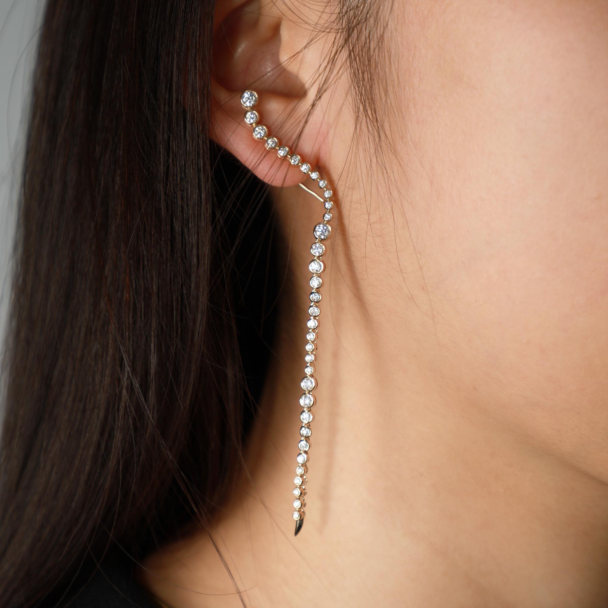 Elegant and timeless, our Longevity Round Diamond 14K Yellow Gold Drop Earrings are designed to embody grace and sophistication. Each earring features a delicate cascade of hand-selected diamonds, expertly set in fine precious metal for a flawless