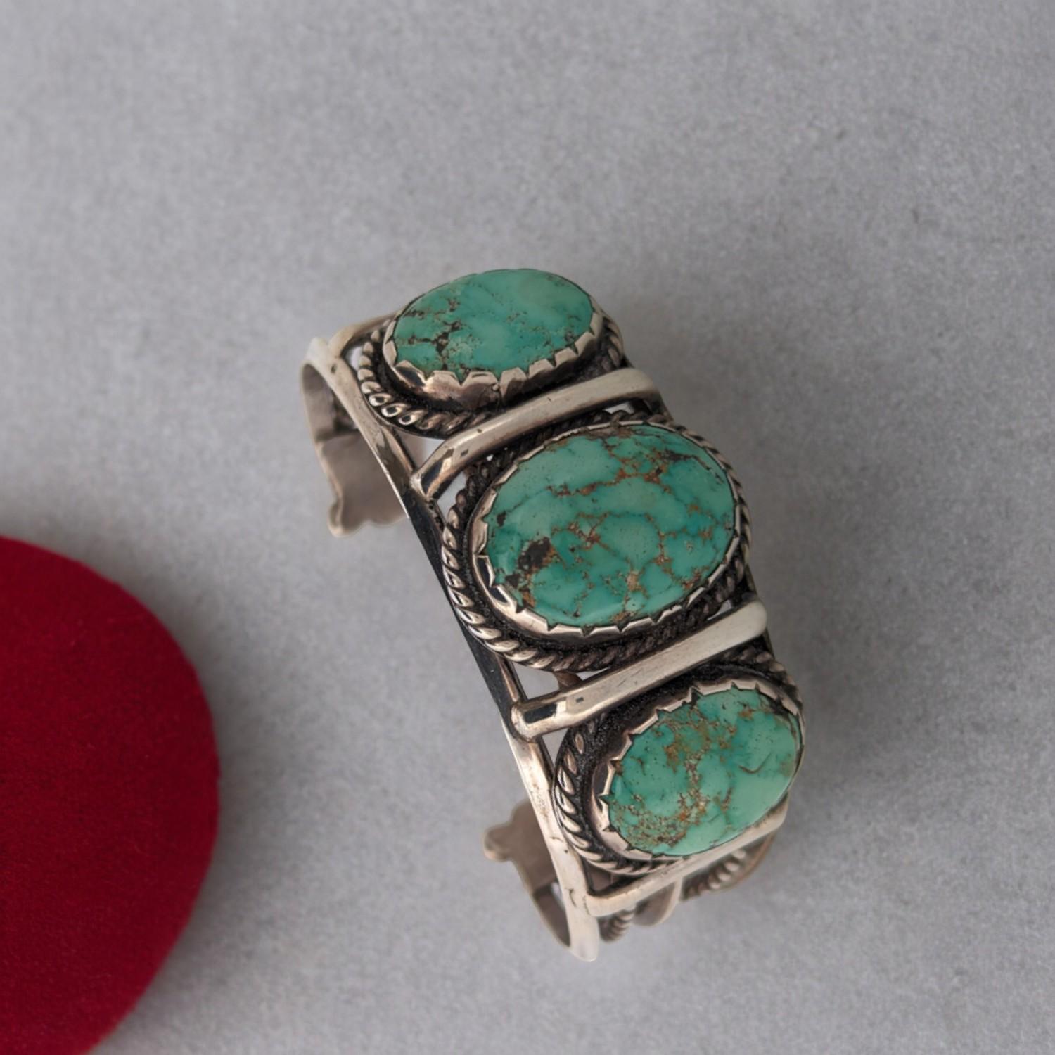 Add a touch of Wild West glamour to your jewelry collection with this stunning vintage turquoise cuff bracelet, expertly crafted by Longhorn Valley. This signed piece is a true treasure, featuring vibrant turquoise stones that evoke the vast open
