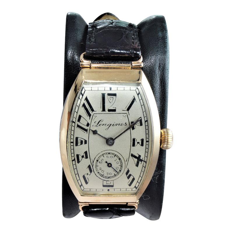 FACTORY / HOUSE: Longines Watch Company
STYLE / REFERENCE: Art Deco / Hinged Tonneau (Barrel Shape)
METAL / MATERIAL: 14Kt Solid Yellow Gold 
DIMENSIONS: Length 50mm X Width 31mm
CIRCA: 1920's
MOVEMENT / CALIBER: Manual Winding / 17 Jewels /  cal.