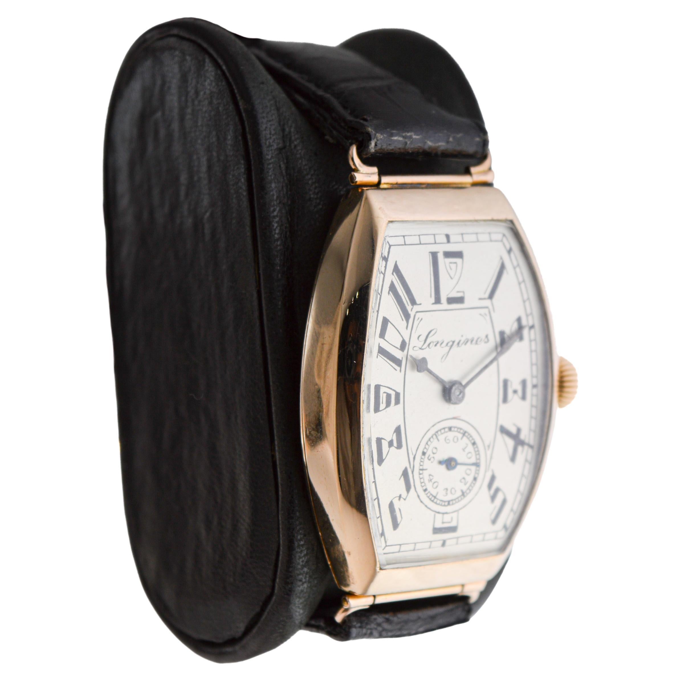 FACTORY / HOUSE: Longines Watch Company
STYLE / REFERENCE: Art Deco / Hinged Tonneau (Barrel Shape)
METAL / MATERIAL: 14Kt Solid Yellow Gold 
DIMENSIONS: Length 50mm X Width 31mm
CIRCA: 1920's
MOVEMENT / CALIBER: Manual Winding / 17 Jewels /  cal.