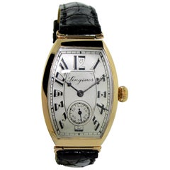 Antique Longines 14 Karat Gold Art Deco Tonneau Shaped Manual Watch, circa 1920s