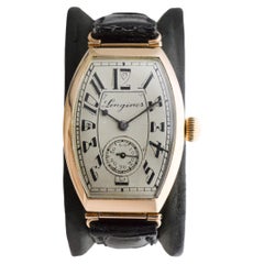Longines 14 Karat Gold Art Deco Tonneau Shaped Manual Watch, circa 1920s