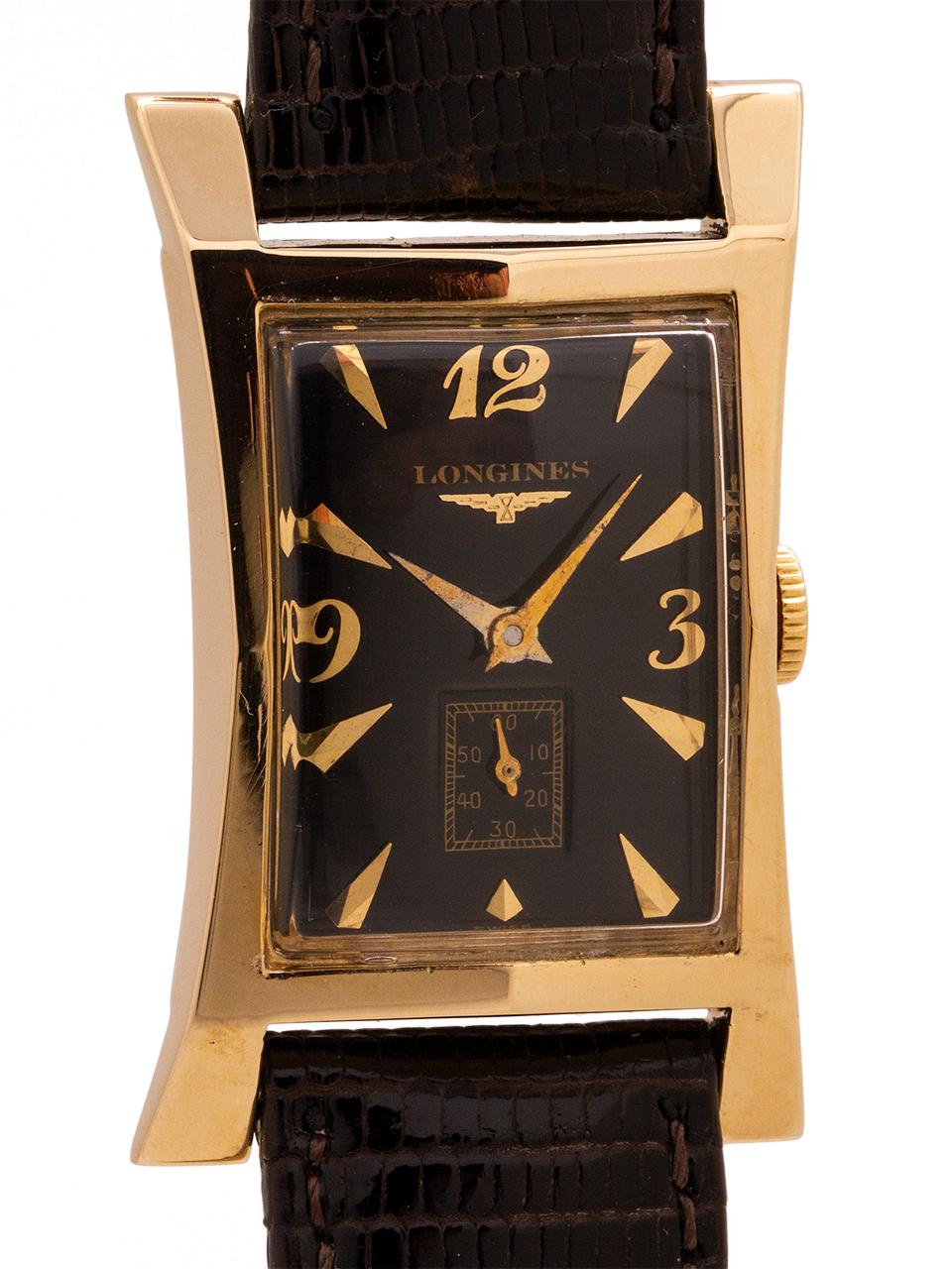 
Longines 14K YG  elongated hour glass shaped case measuring 21mm at its narrowest, 27mm at its widest and 41mm lug to lug. Scarce vintage model in exceptional condition. With beautifully restored gloss black dial with gold raised indexes and gold