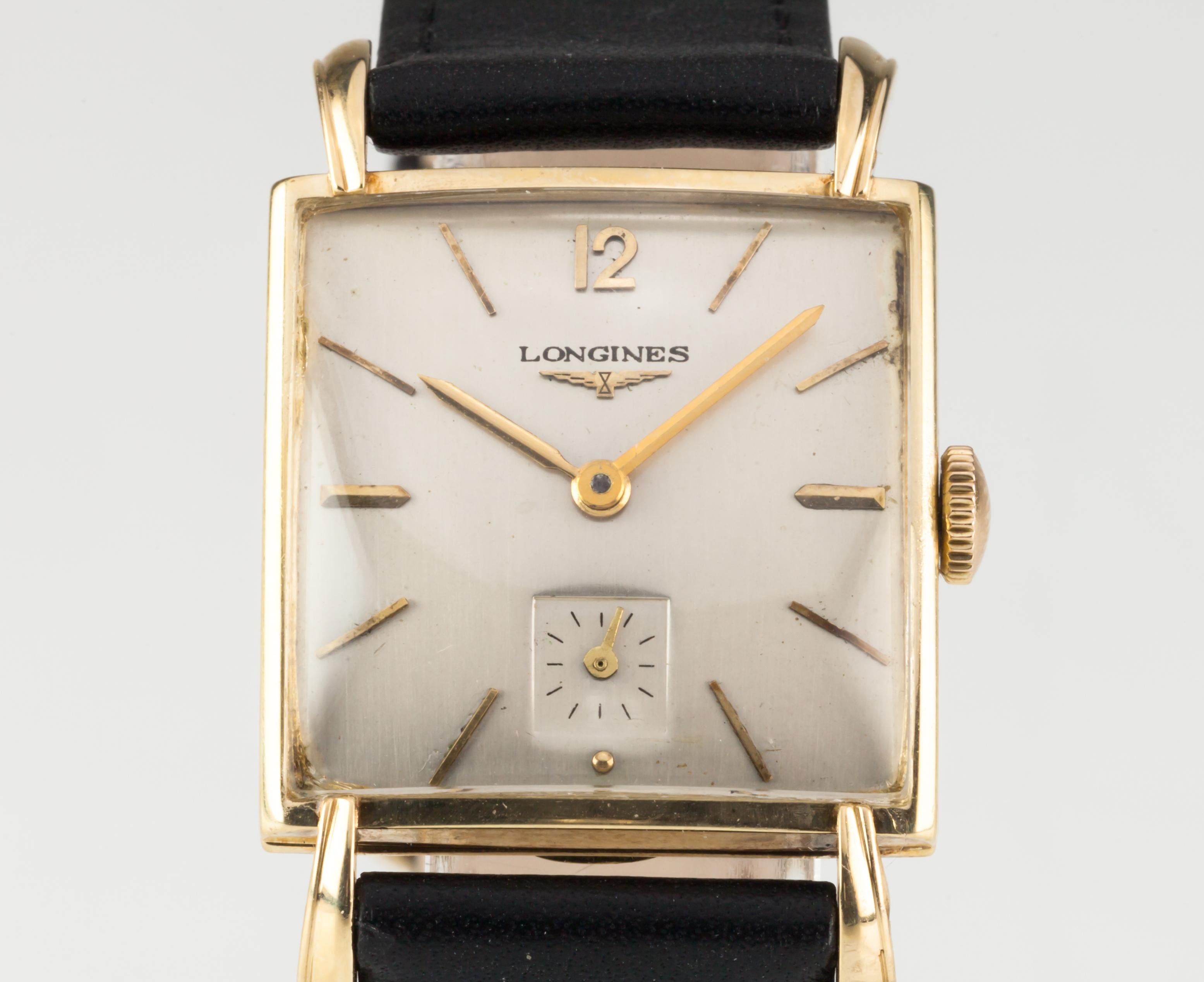 Longines 14k Yellow Gold Men's Square Mechanical Watch 22L 1960s w/ Leather Band

Movement #22L
Movement Serial #9410749
Case #160
Case Serial #5990

14k Yellow Gold Square Case
25 mm Wide (27 mm w/ Crown)
26 mm Long
Lug-to-Lug Distance = 39