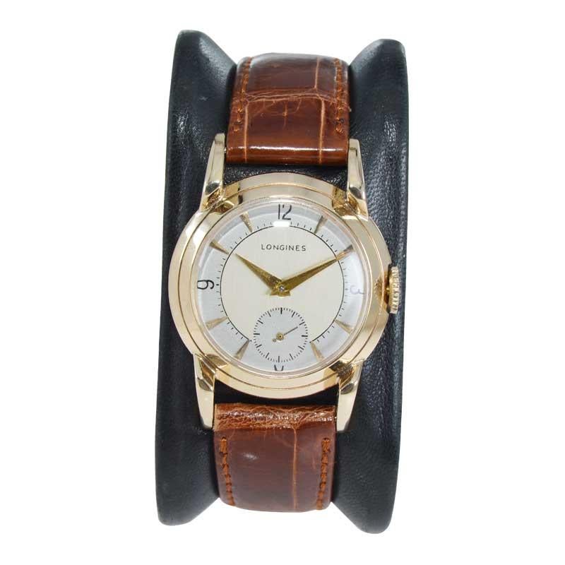 FACTORY / HOUSE: Longines Watch Company
STYLE / REFERENCE: Art Deco / Round
METAL / MATERIAL: 14kt Solid Gold
CIRCA / YEAR: 1940's 
DIMENSIONS / SIZE: Length 39mm x Diameter 29mm
MOVEMENT / CALIBER: Manual Winding / 17 Jewels / Cal. 104
DIAL /