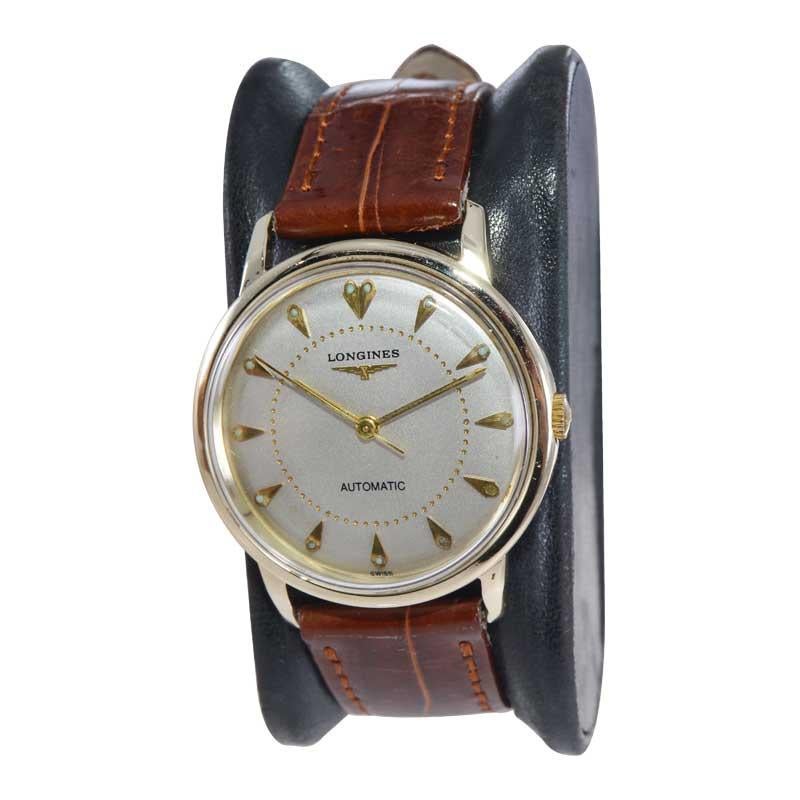 FACTORY / HOUSE: Longines Watch Company
STYLE / REFERENCE: Round Dress Style
METAL / MATERIAL: 14kt Solid Gold
CIRCA / YEAR: 1950's
DIMENSIONS / SIZE: 32mm x 38mm
MOVEMENT / CALIBER: Automatic Winding / 17 Jewels / Cal.19AS
DIAL / HANDS: Silvered