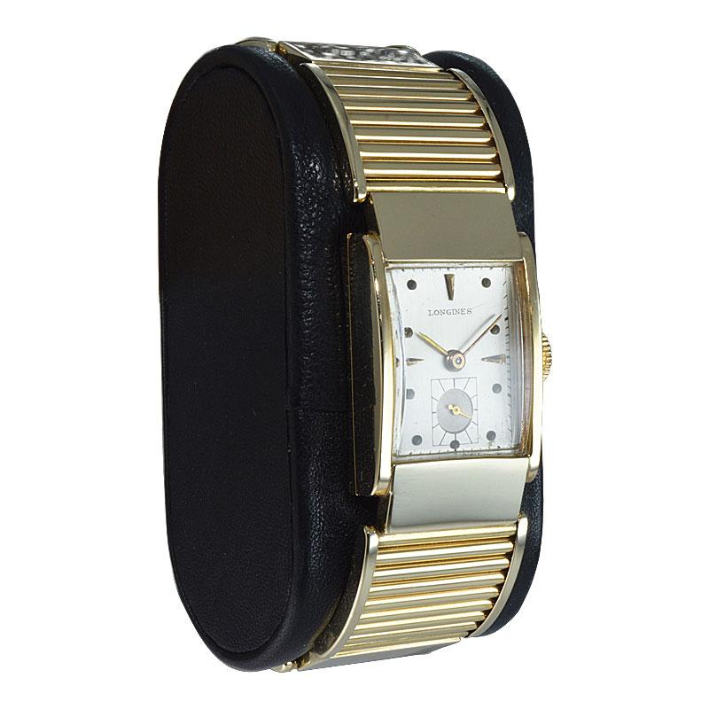 FACTORY / HOUSE: Longines Watch Company
STYLE / REFERENCE: Art Deco Integrated Bracelet
METAL / MATERIAL: 14Kt. Solid Yellow Gold 
DIMENSIONS: Length 36mm  X Width 20mm
CIRCA / YEAR: 1940's
MOVEMENT / CALIBER: Manual Winding / 17 Jewels / Cal.