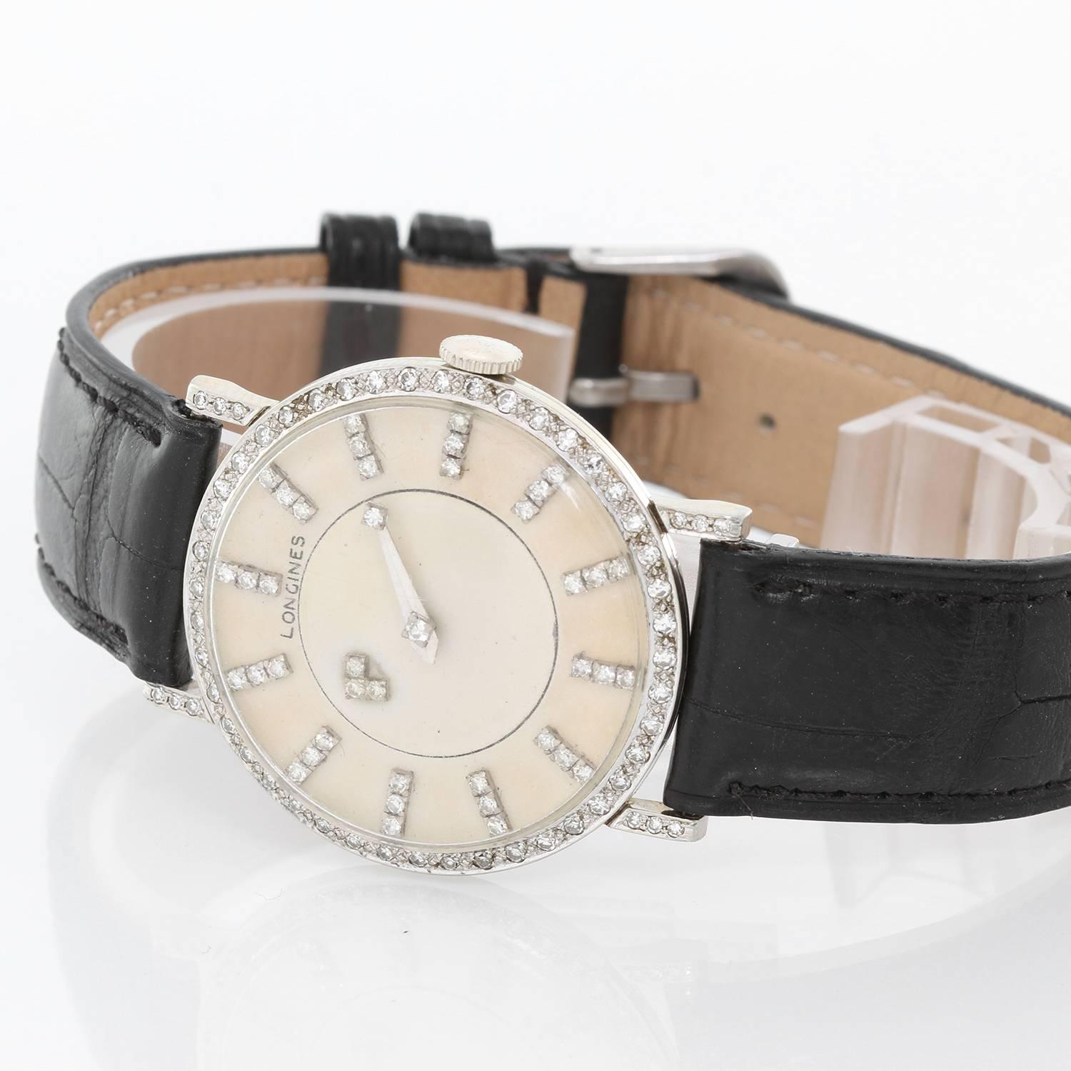 Longines 18K White Gold 1950's Mystery Dial Watch -  Manual winding. 18K White Gold with a diamond bezel and diamonds on the lugs ( 37 mm ). Silver tone with 12 three diamond markers. Three diamond rotating disk for hours and 2 diamonds on minute