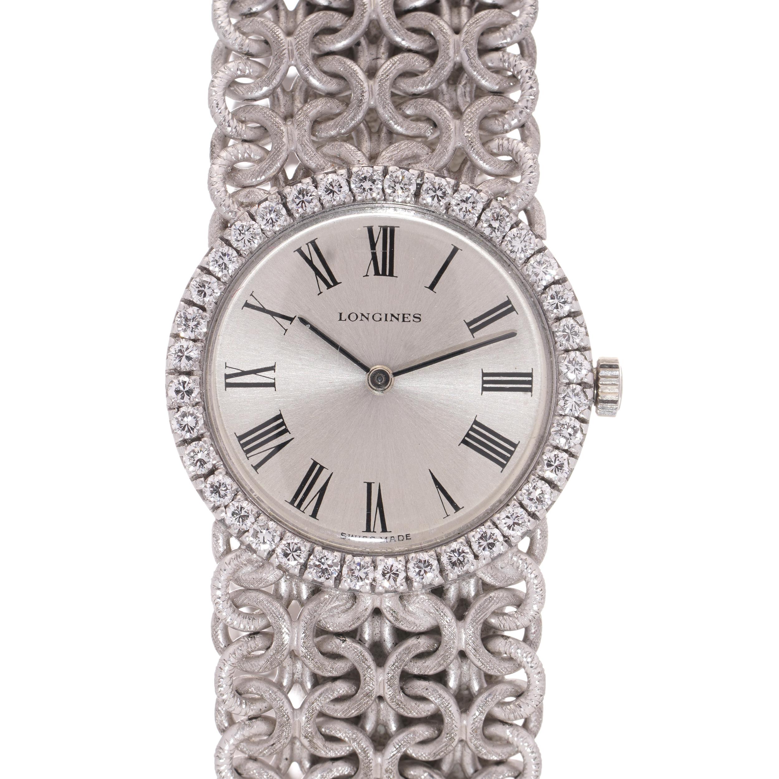 Longines 18kt. white gold ladies' wristwatch with diamond-set bezel.
Made in Switzerland. Circa 1970's

Year 1970s
Item Specifics:
Case Diameter (without crown): 23 mm
Case material: 18kt. white gold
Bracelet material: 18kt. white gold
Bezel: 18kt