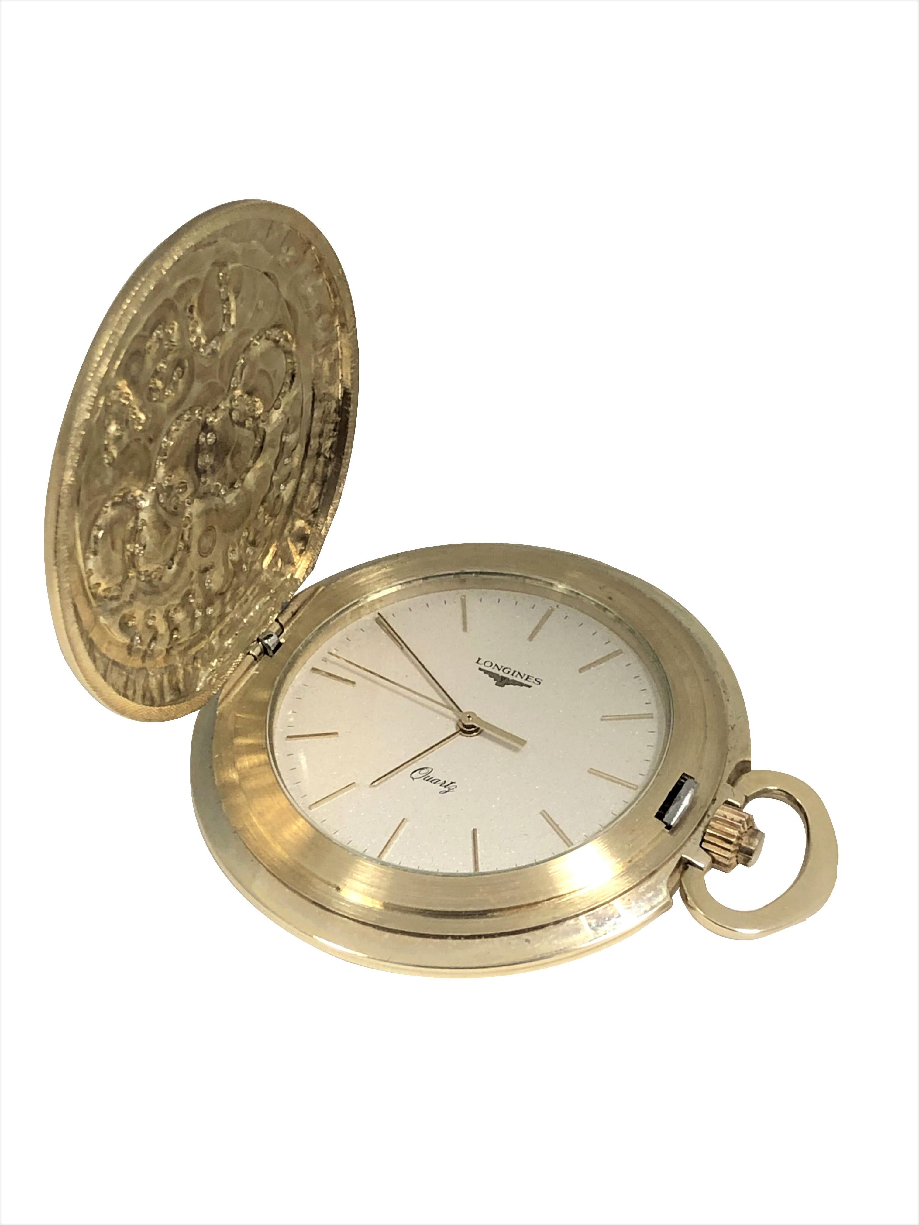 Circa 1984 Longines Commemorative Limited Edition Pocket Watch of the 1984 Los Angeles Olympics,  46 M.M. in Diameter and 8.5 M.M. thick 14K Yellow Gold Hunting covered Case. Quartz Movement, Silver and Gold speckled Dial with Raised Gold Baton